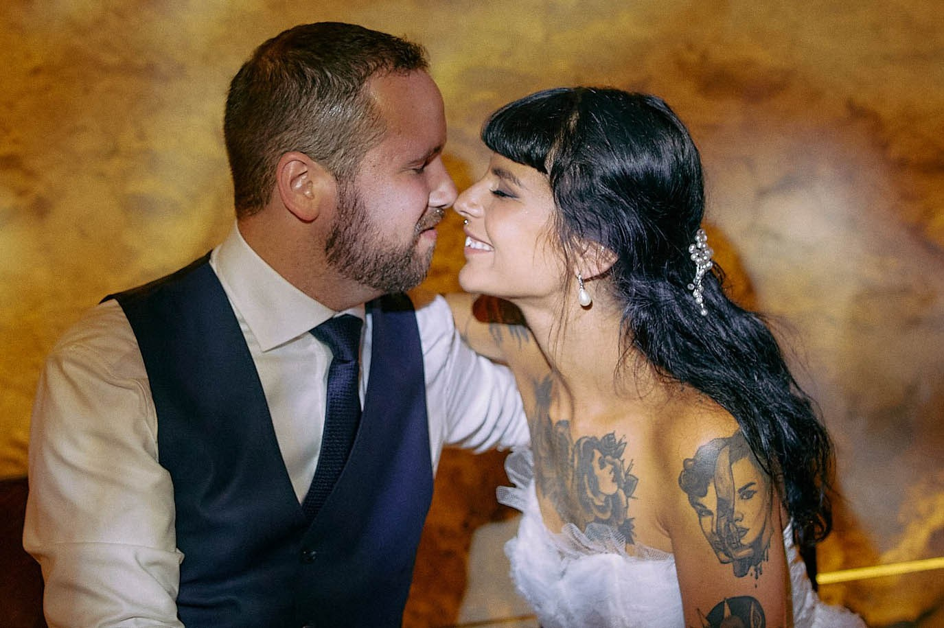 Courtney and Dean are embracing lovingly during a late-night wedding celebration.