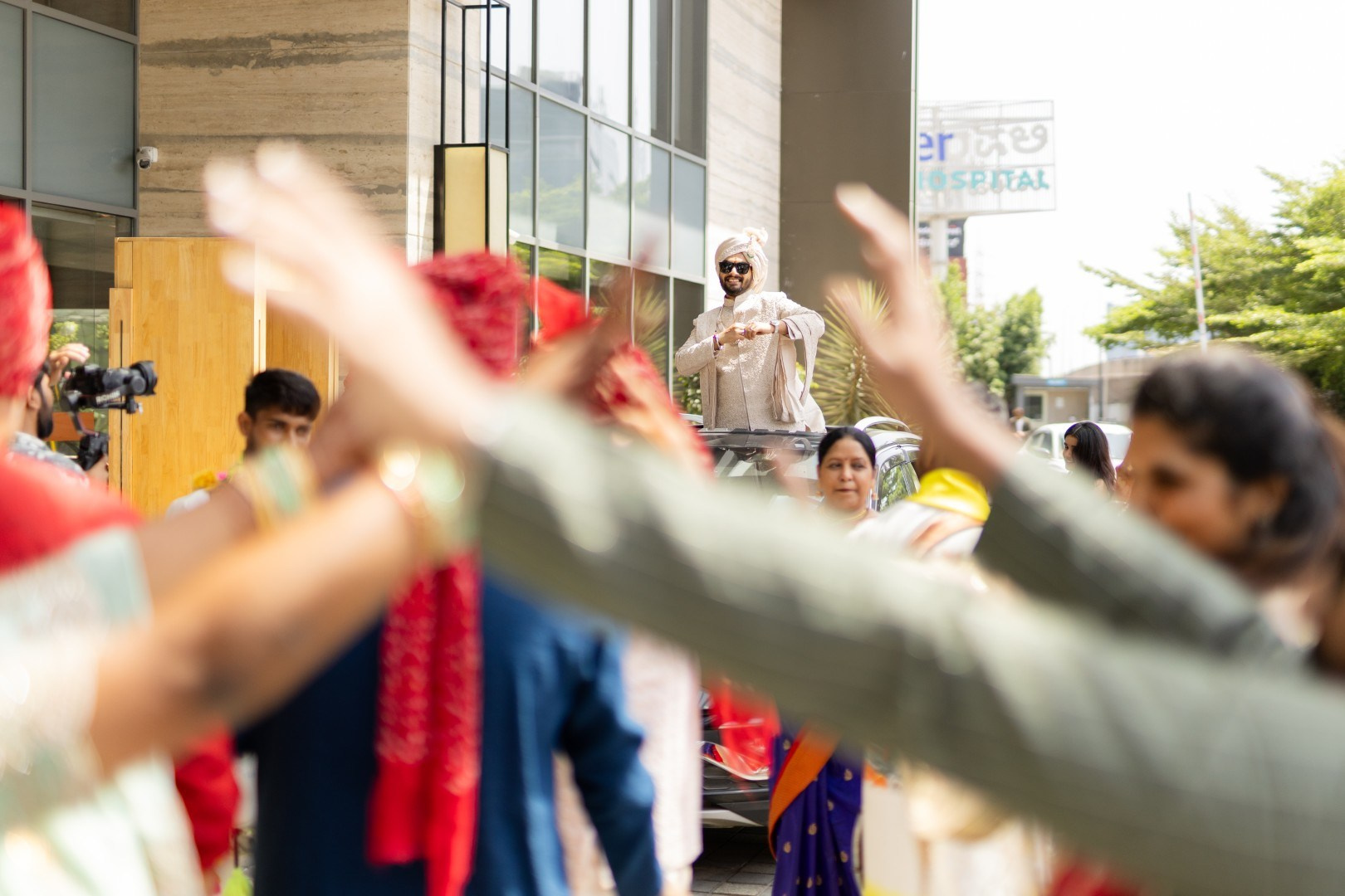 Hands in the Air: Chiranjeev & Niharika at Hyatt Centric Hebbal. Truly Yours | Documentary Wedding Photography & Films | Sharath Padaru, Bangalore