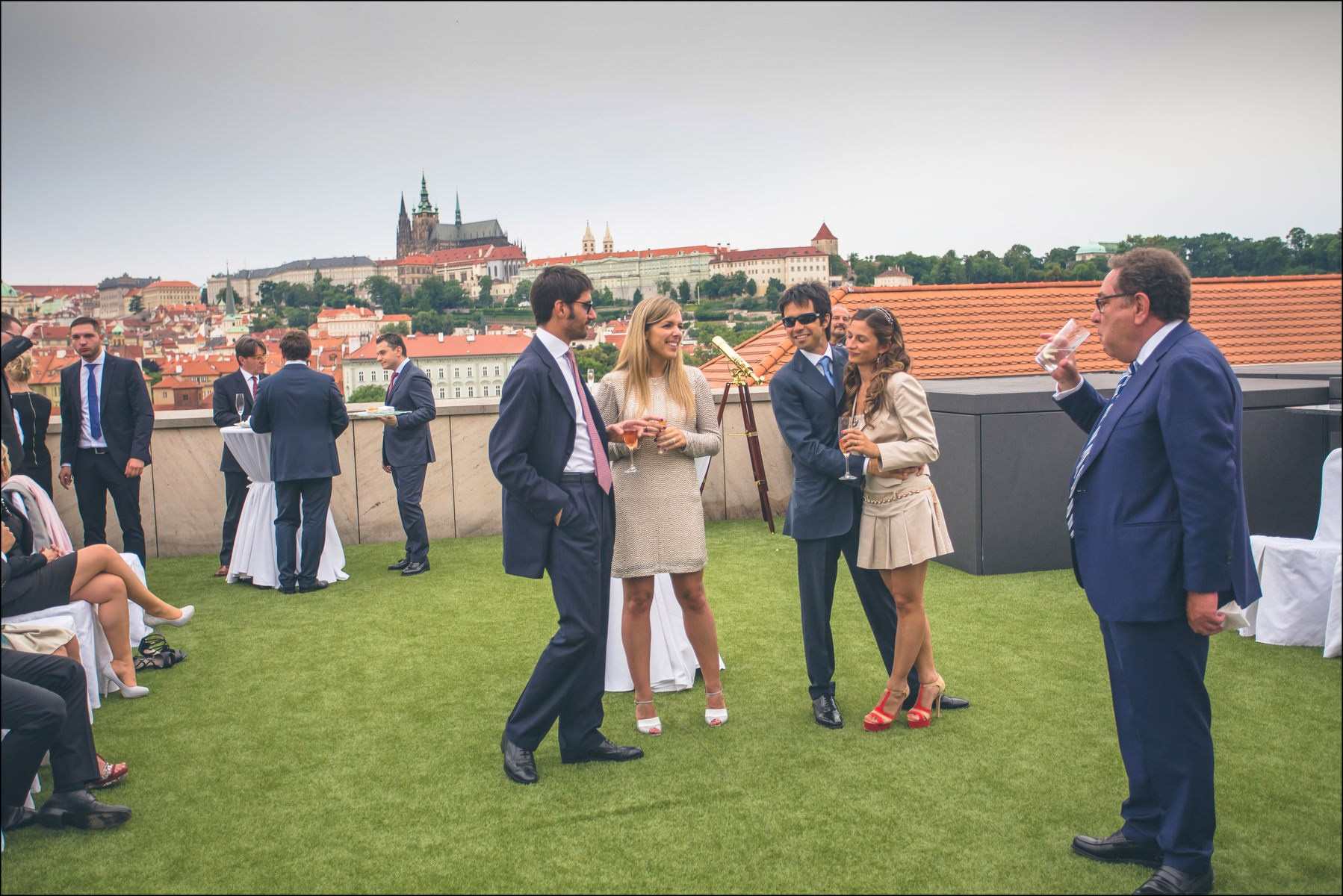 Wedding guests awaiting newlyweds on Four Seasons rooftop terrace Prague