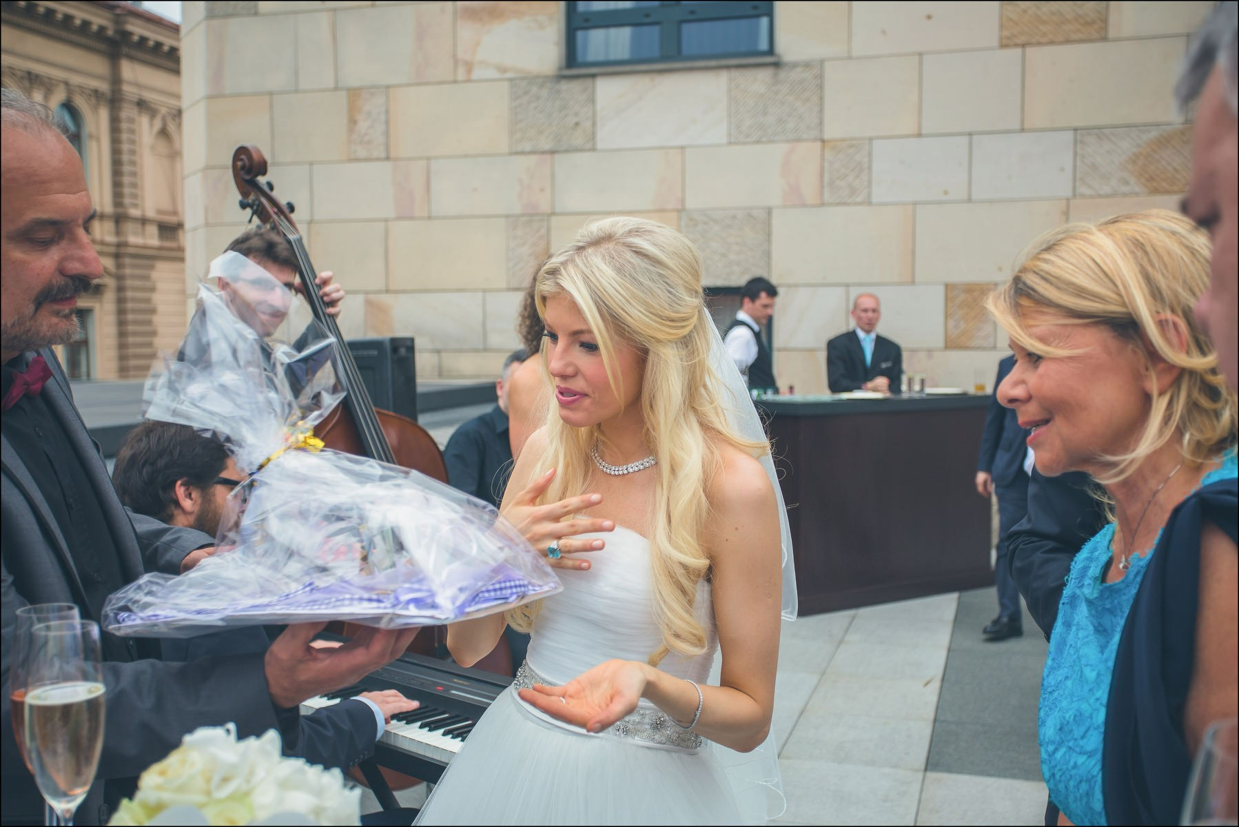 Bride Julia smiling while receiving wedding gift Four Seasons Prague