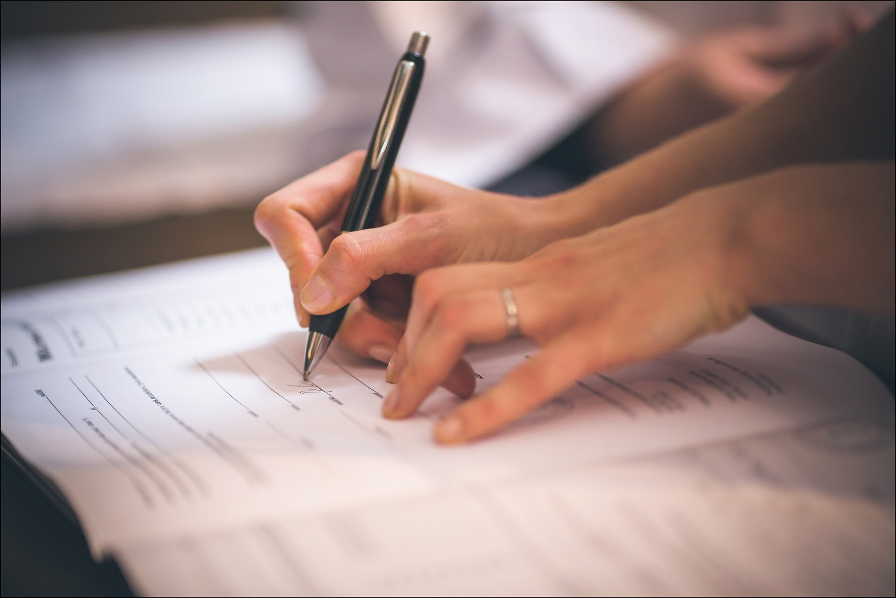 Signing marriage certificate at St. Thomas Church Prague ceremony