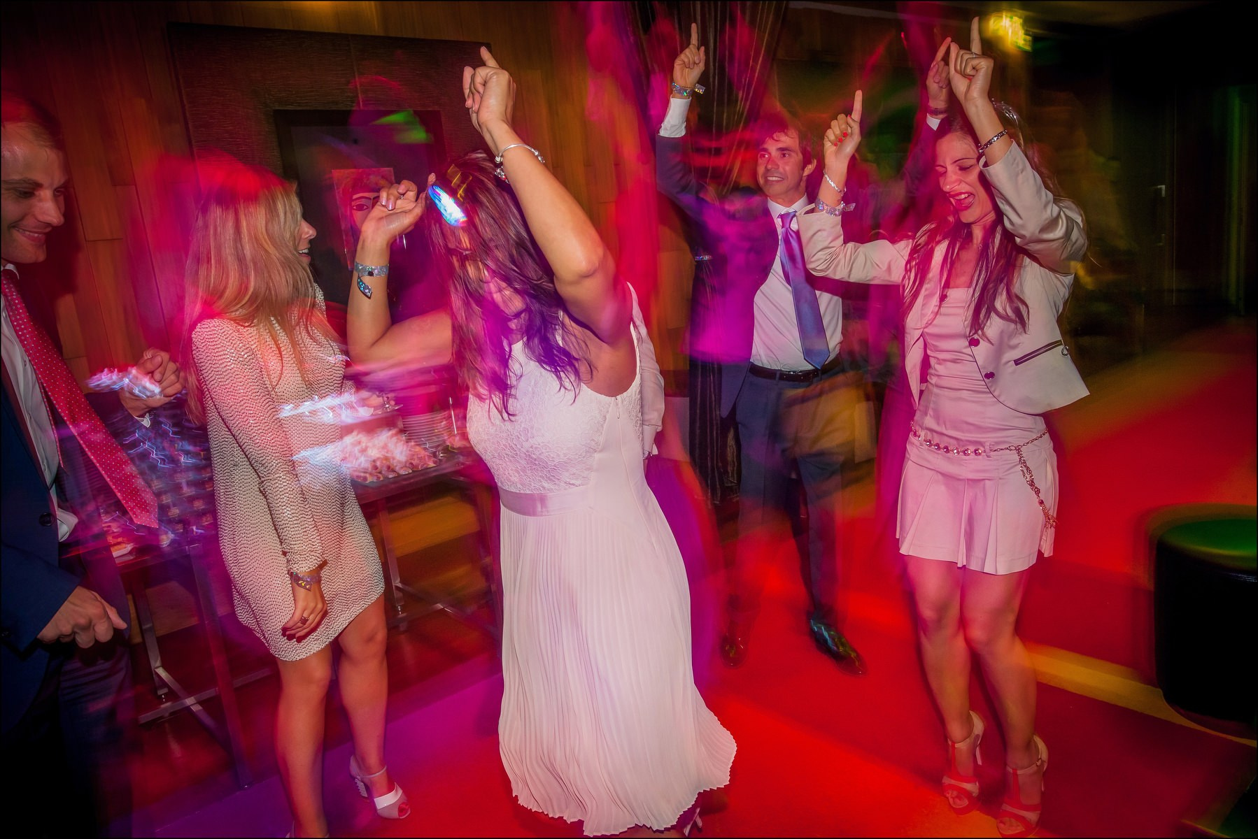 Guests waving arms singing popular song wedding party Prague