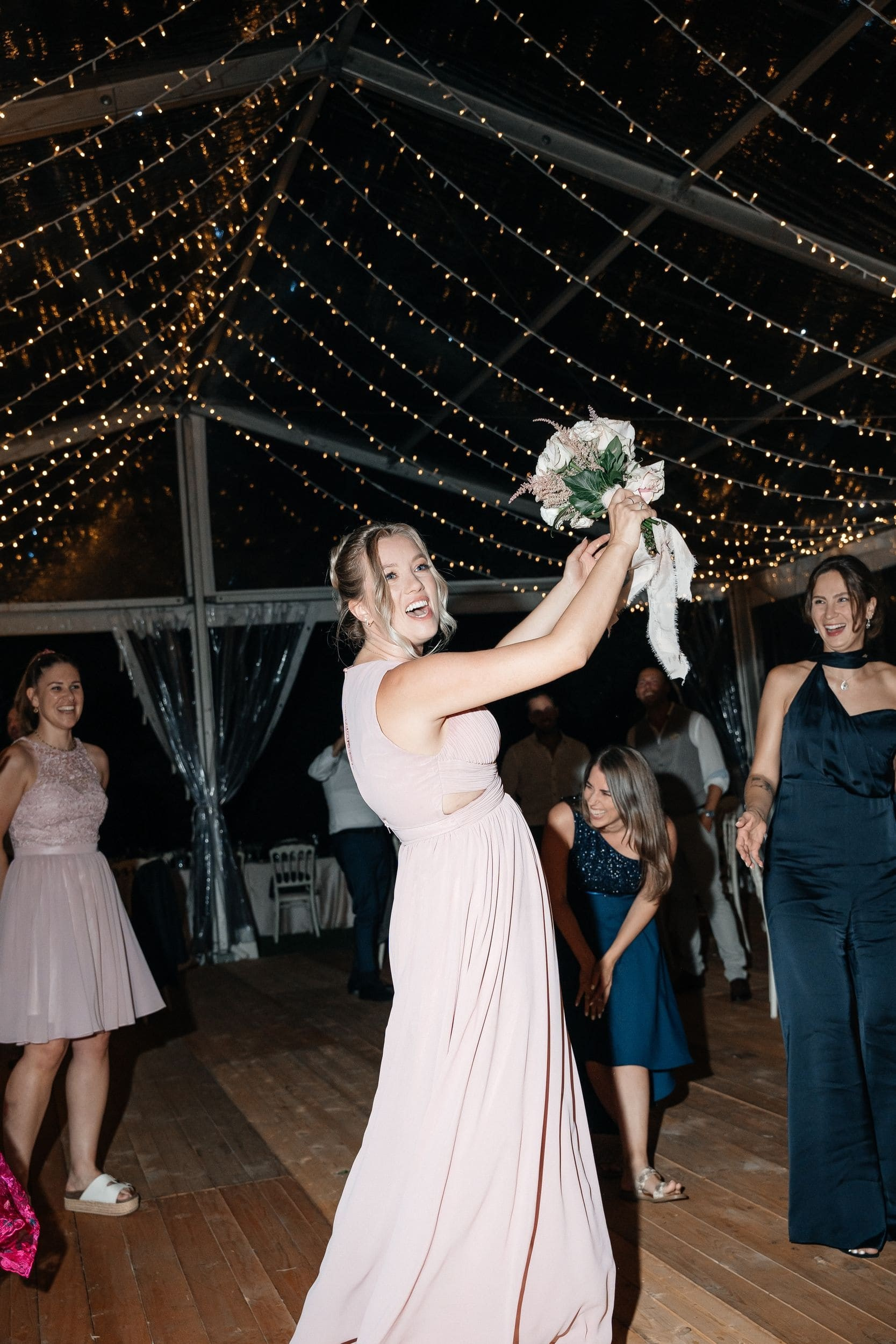 bridesmaid get the bouqet