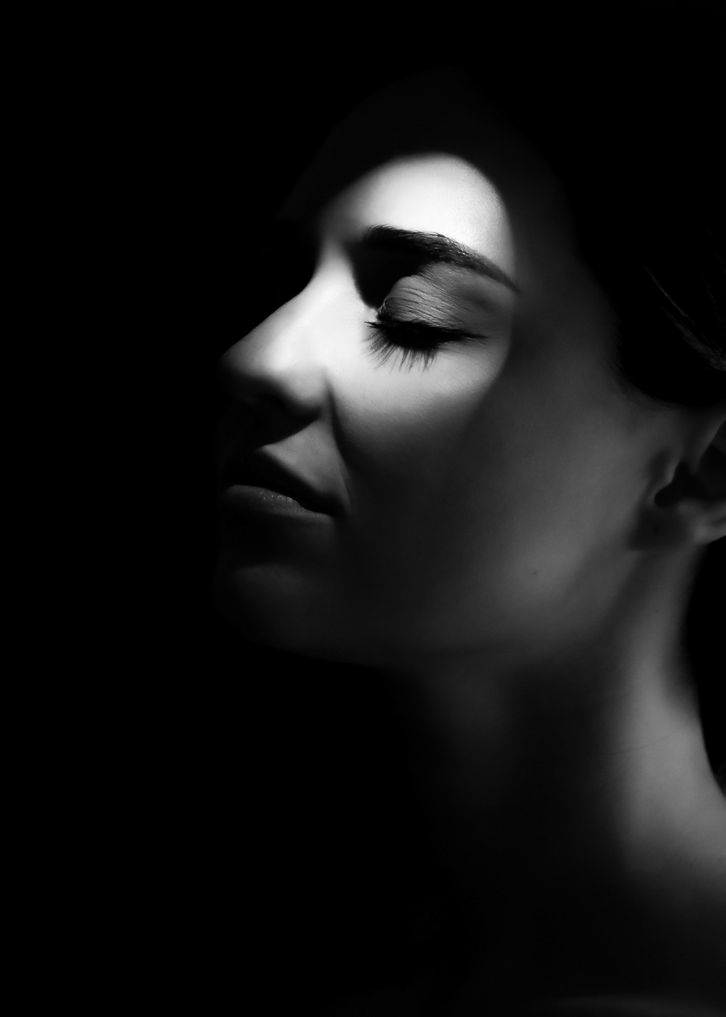 Creative black-and-white portrait with dramatic lighting