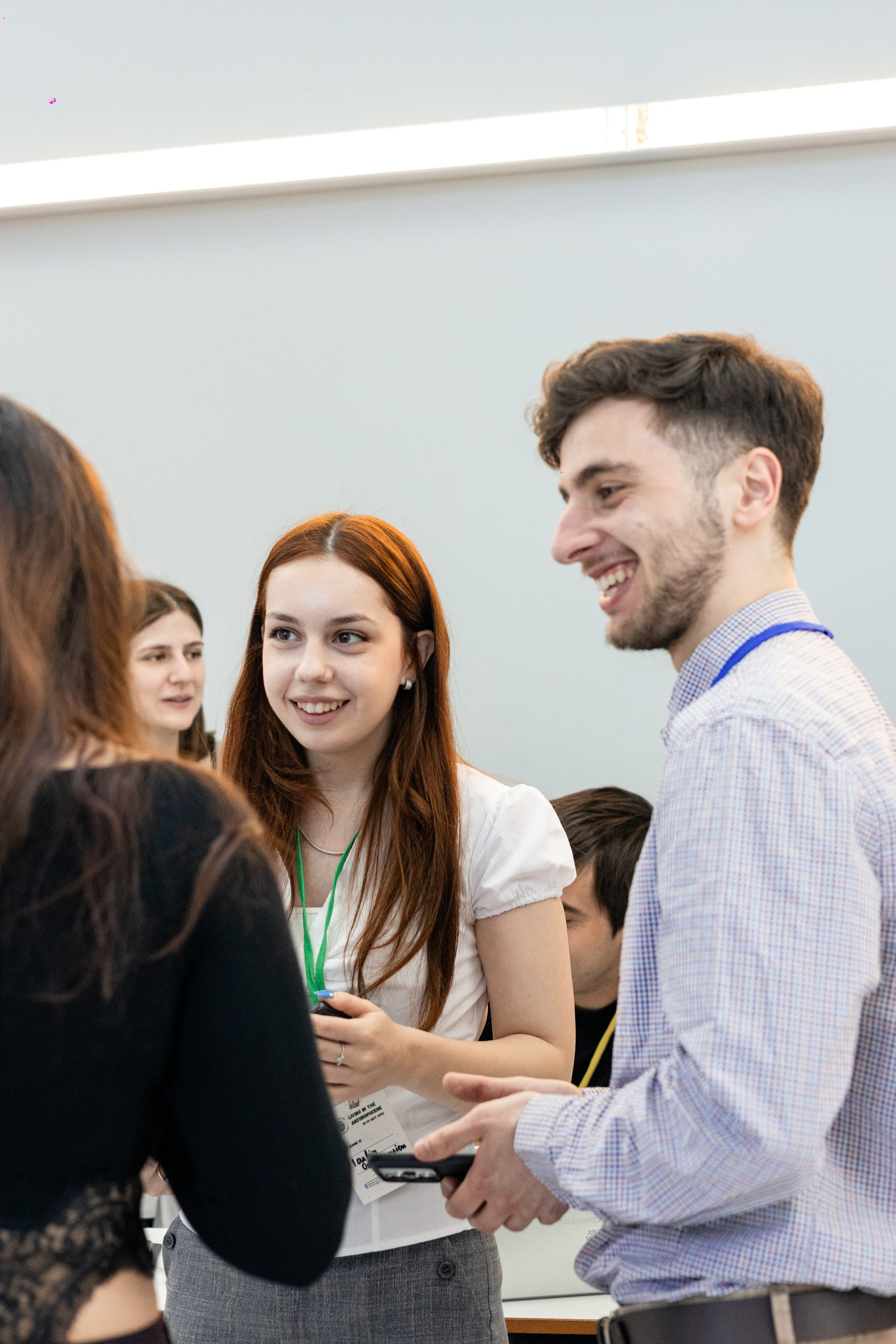 Conference participants discussing research projects