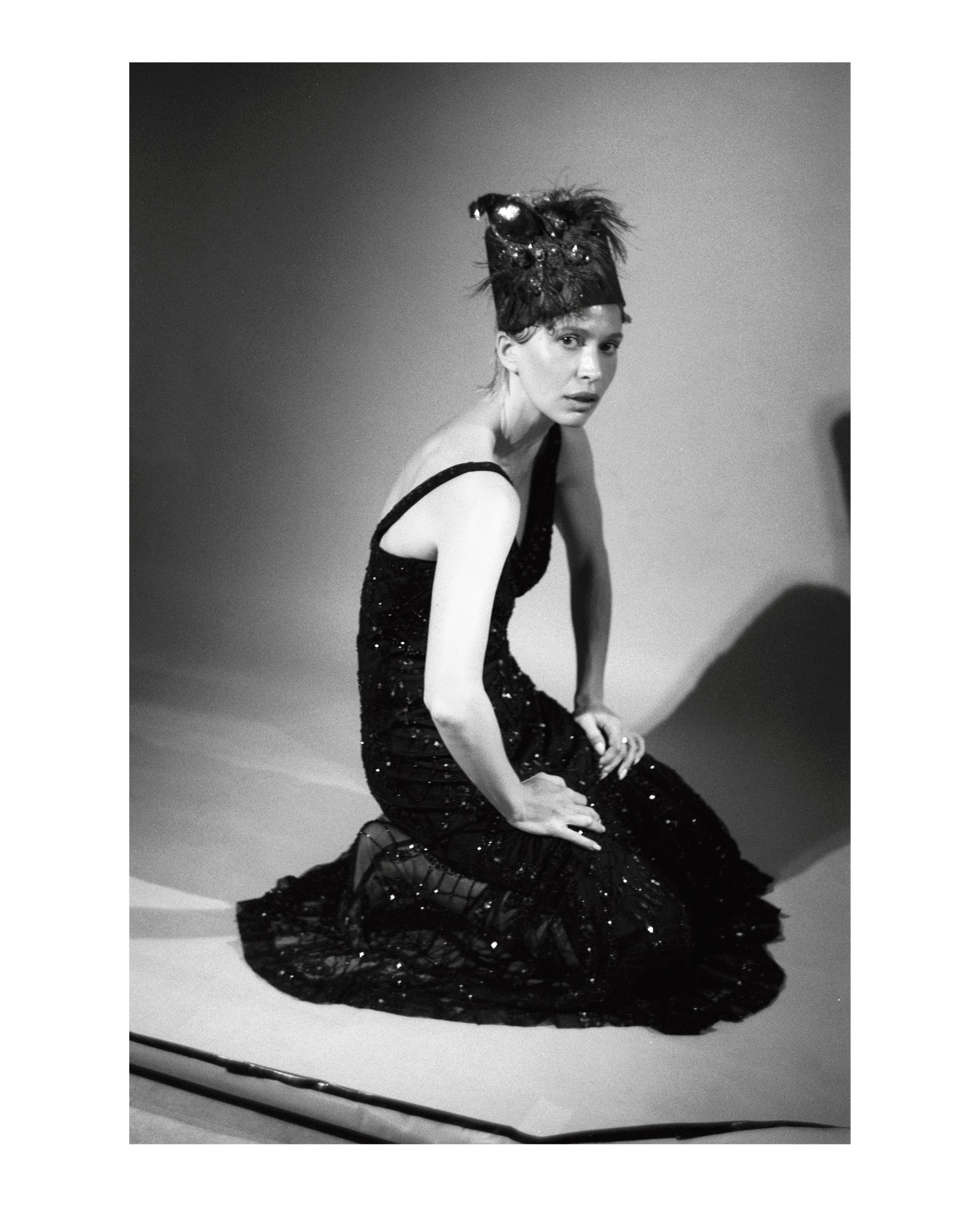 Creative black and white film portrait in a Tallinn studio, captured on 35mm analog film.