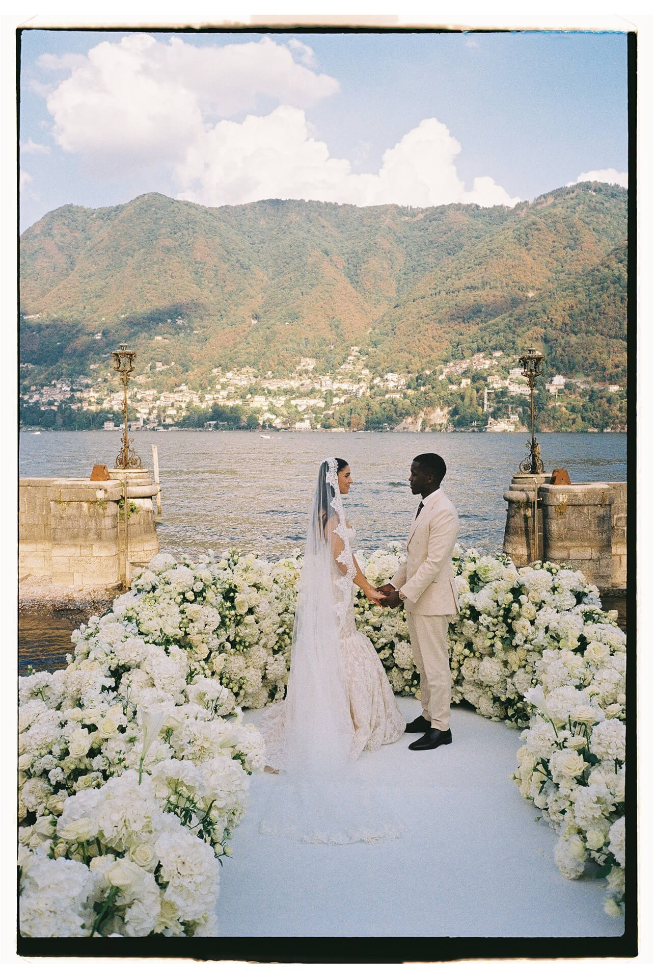 Bride and groom at the altar of a lakeside wedding ceremony at Villa Erba, Lake Como