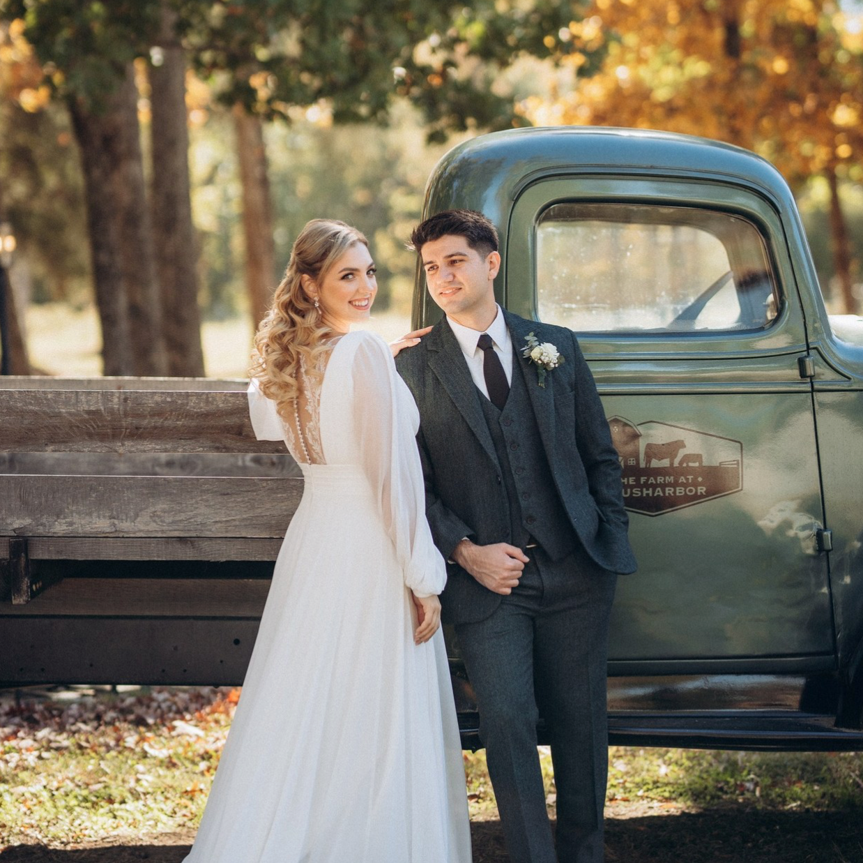 Engaged couple embracing under the Brooklyn Bridge skyline