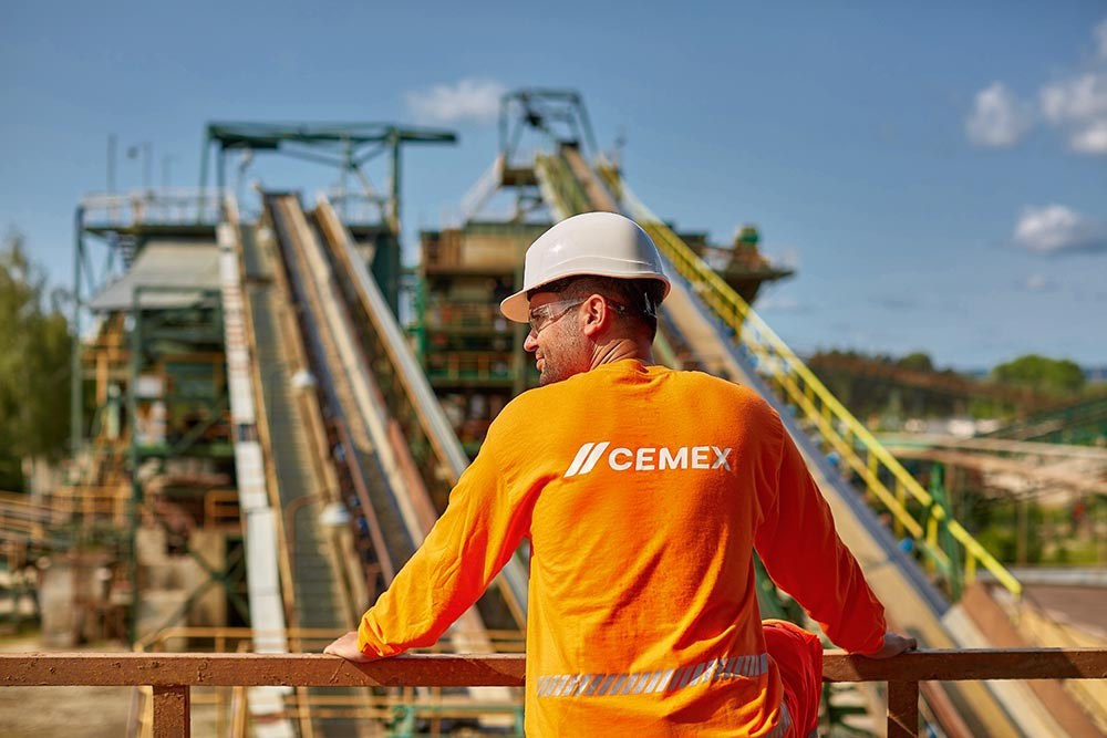 Industrial and Manufacturing photographer - CEMEX employee overlooking facilities in Prachovice, Czechia.