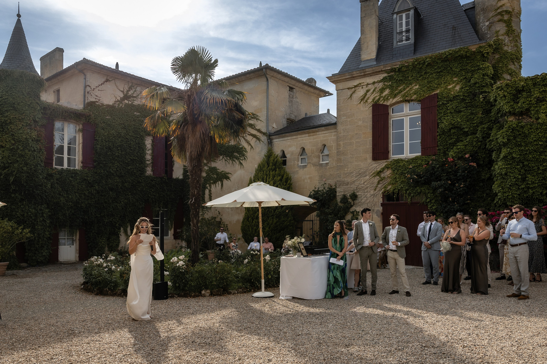 Guests enjoying a relaxed cocktail at a destination wedding in France