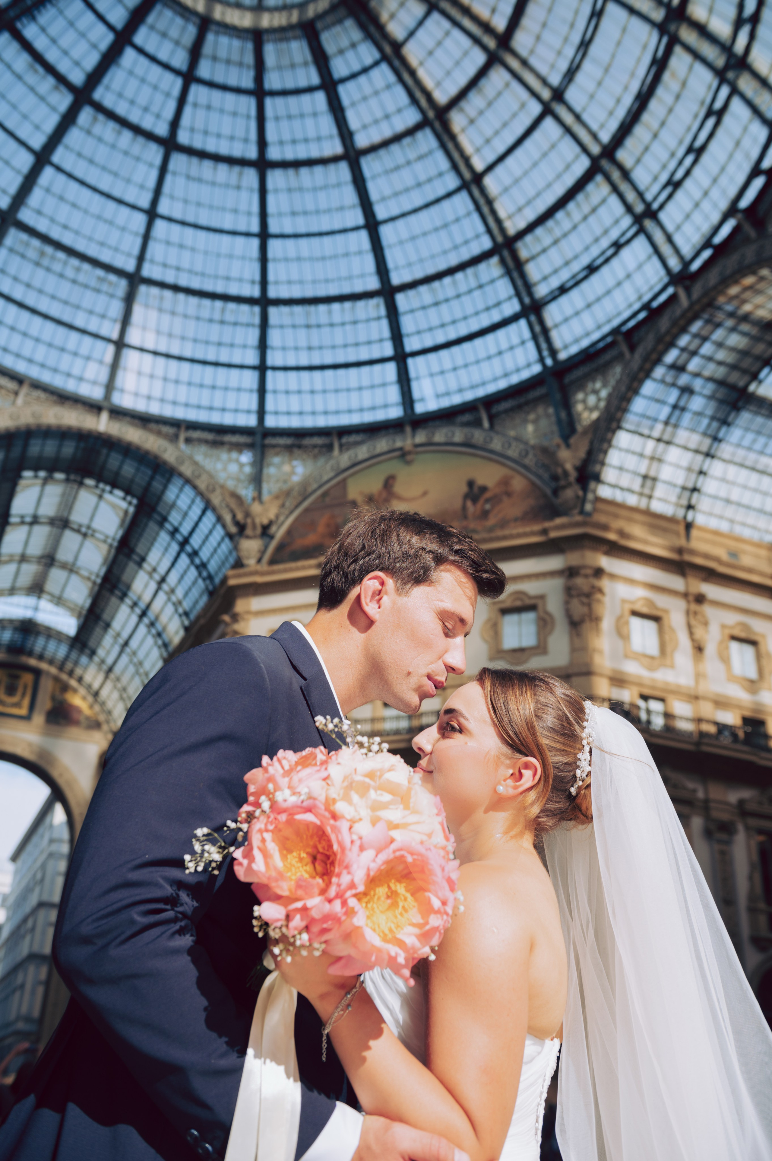 Wedding couple portrait inside Galleria Vittorio Emanuele II in Milan, Italy. Milan Wedding Photographer