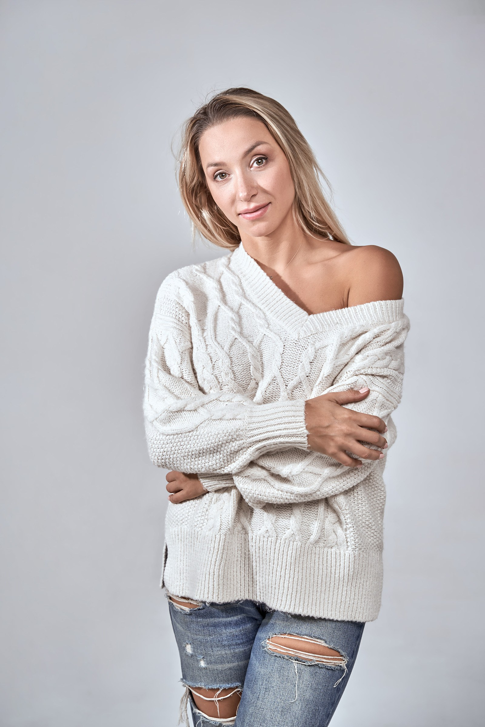 Woman in a soft natural wool sweater, commercial product photo for marketplace listing