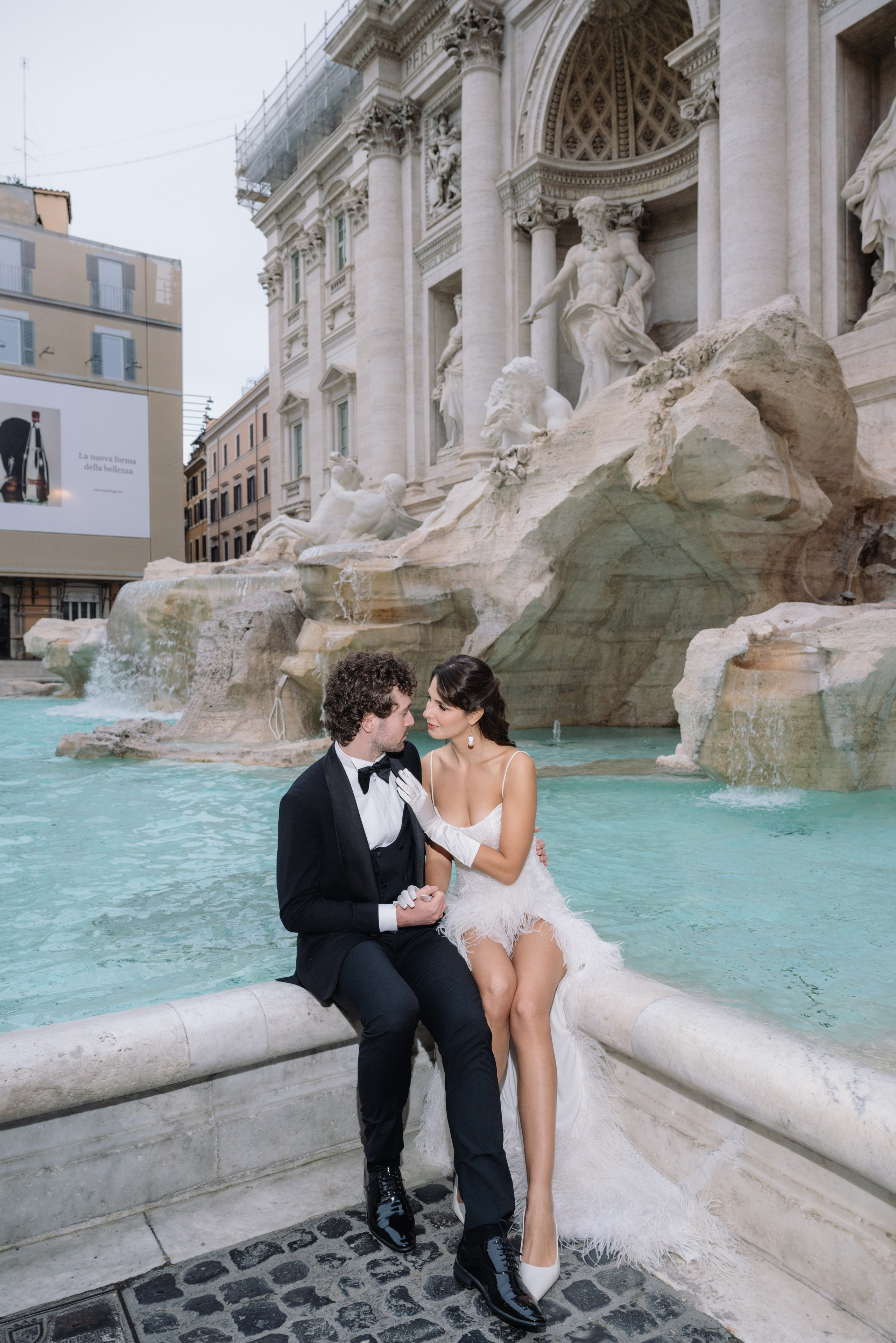 A cinematic elopement in Rome at sunrise, with quiet cobblestone streets, a vintage Vespa, and the Trevi Fountain in the rain