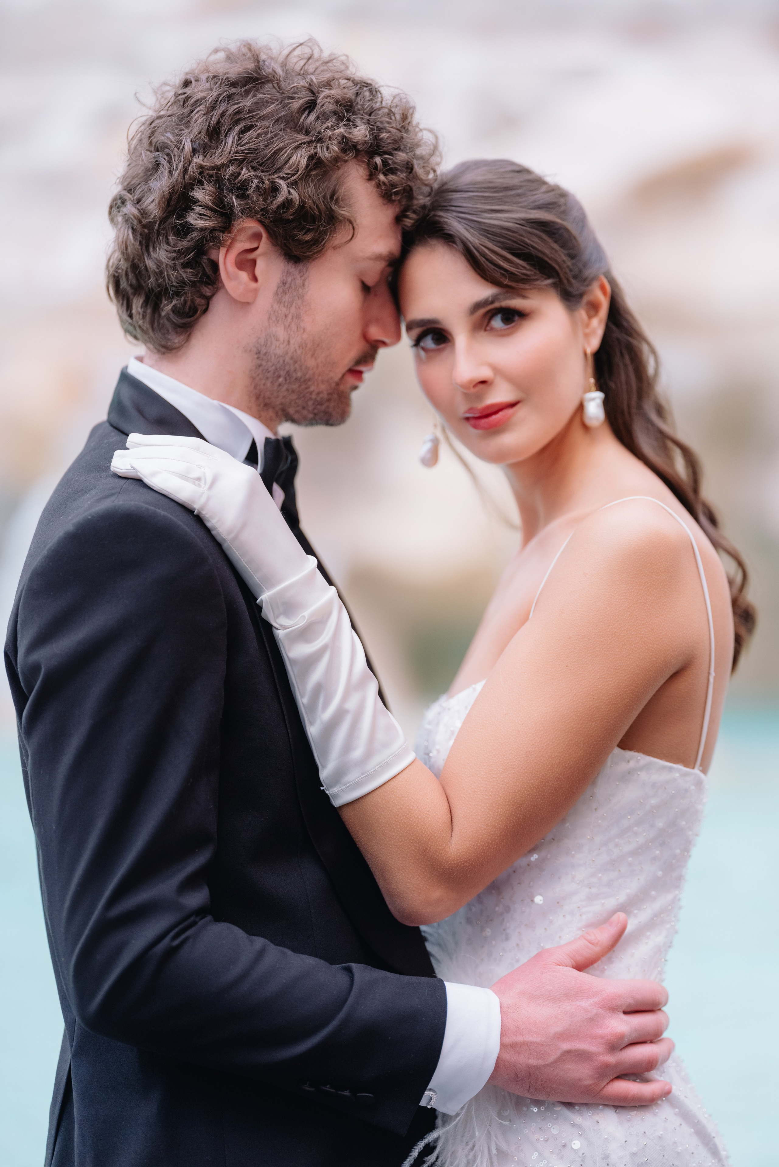 A cinematic elopement in Rome at sunrise, with quiet cobblestone streets, a vintage Vespa, and the Trevi Fountain in the rain