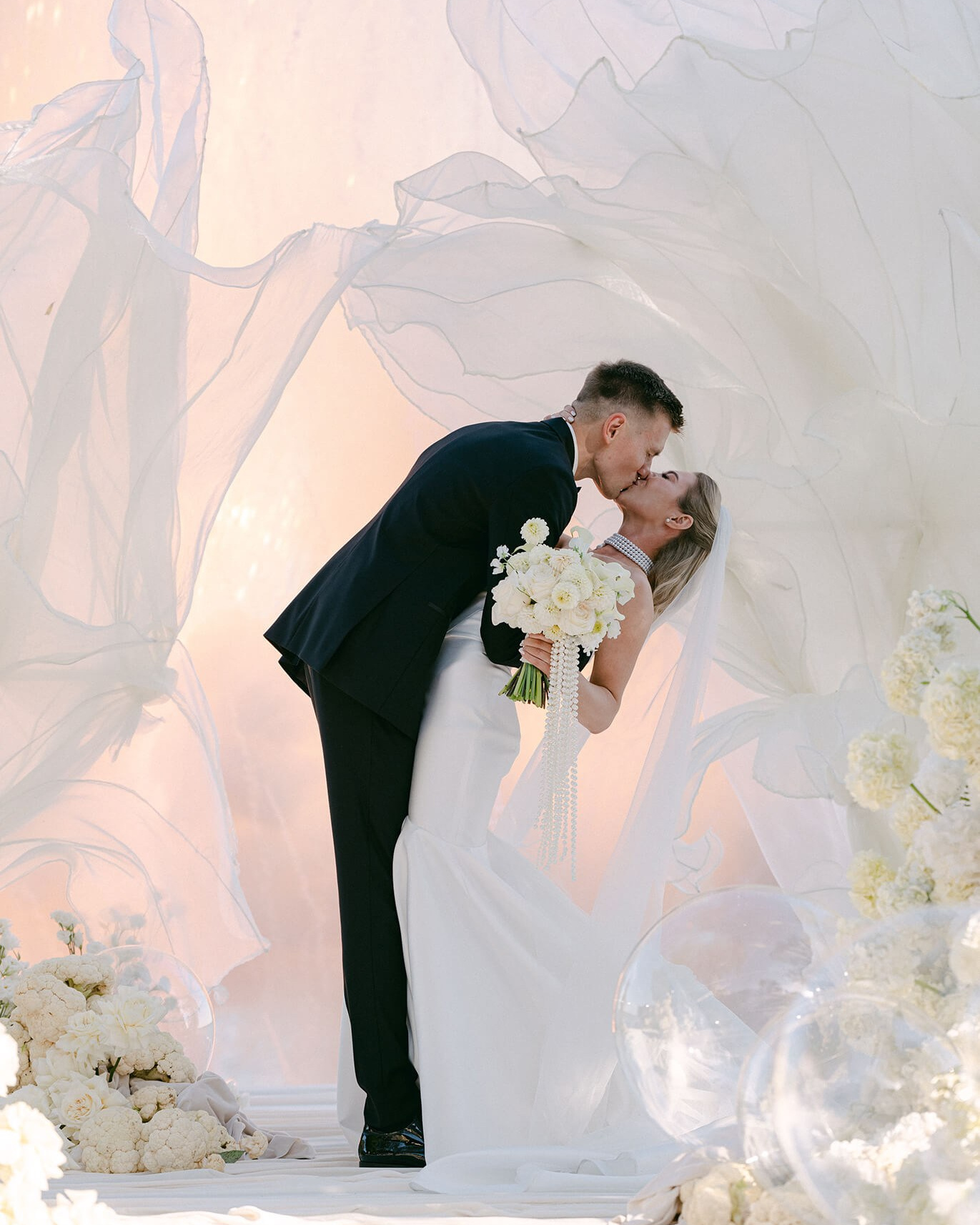 Bride and groom in a vintage convertible, olive grove and cypress trees, Provence