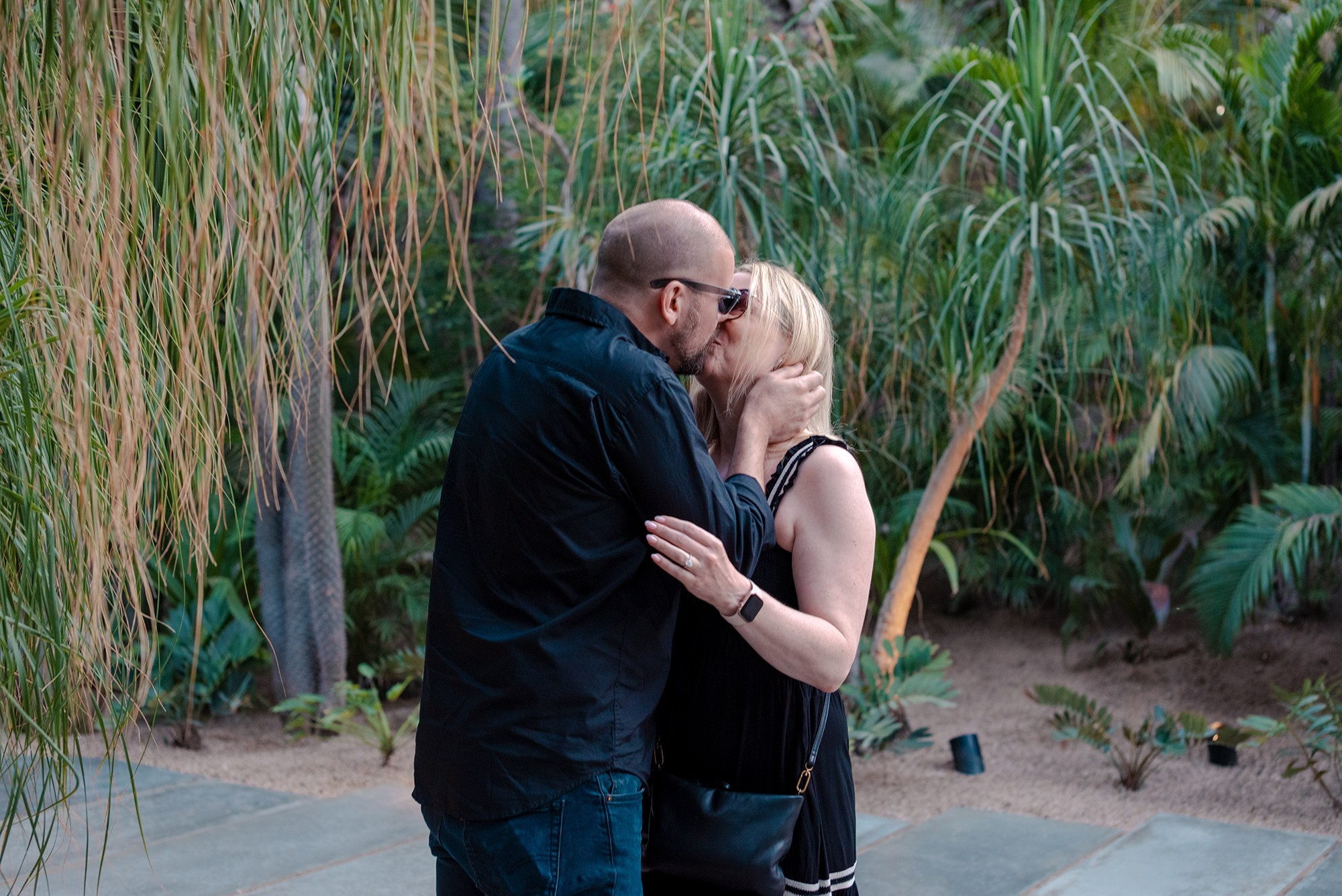 First kiss as newly engaged couple at Acre Restaurant San José del Cabo destination proposal photographer