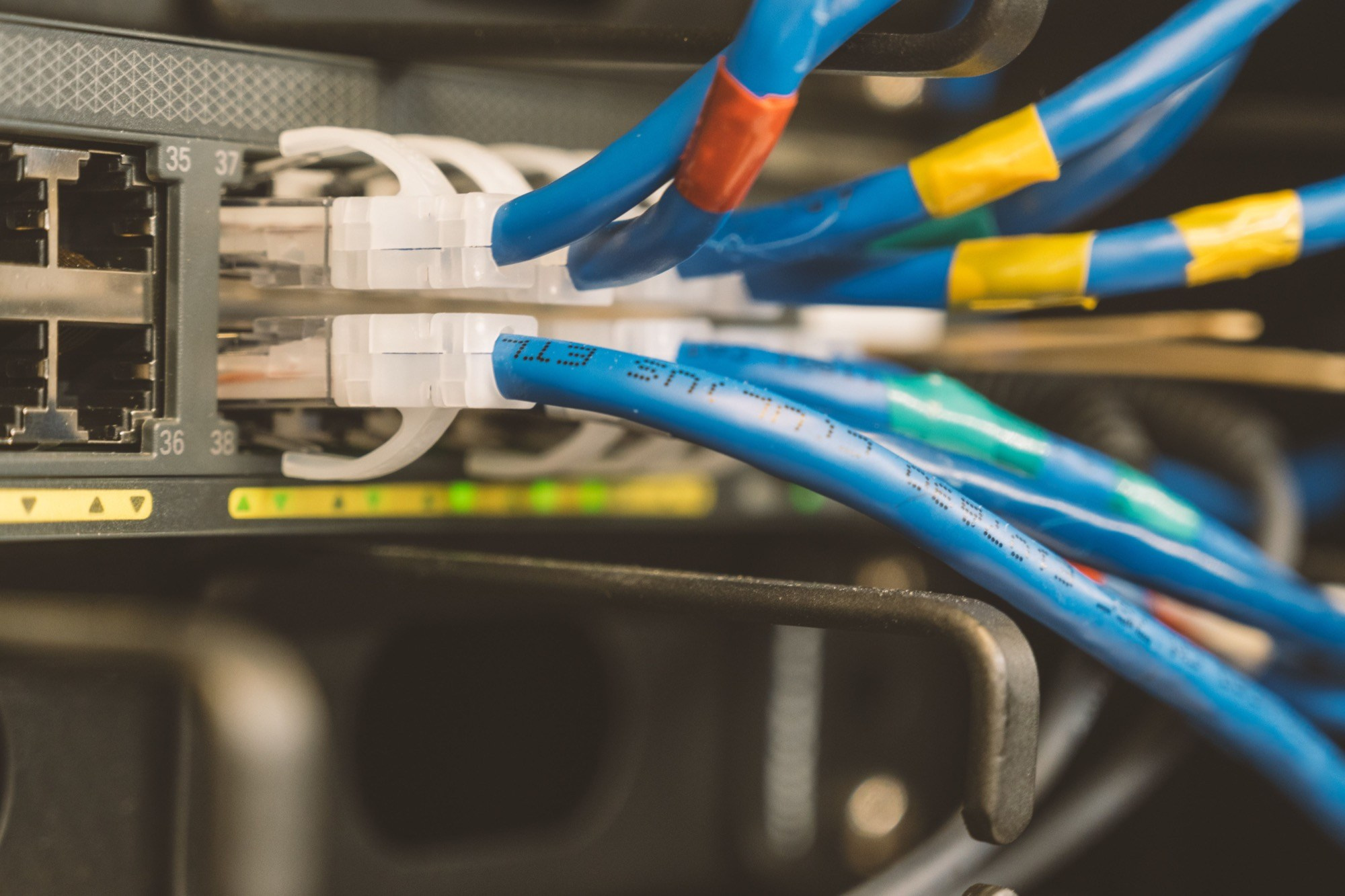 Ethernet cables connected to network equipment for a reliable event livestream