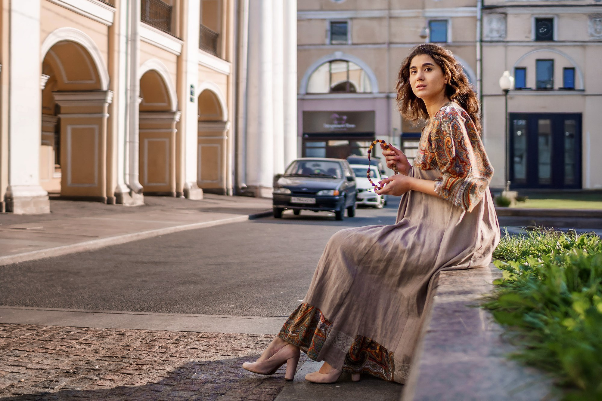 Woman with long hair in a traditional dress outdoors