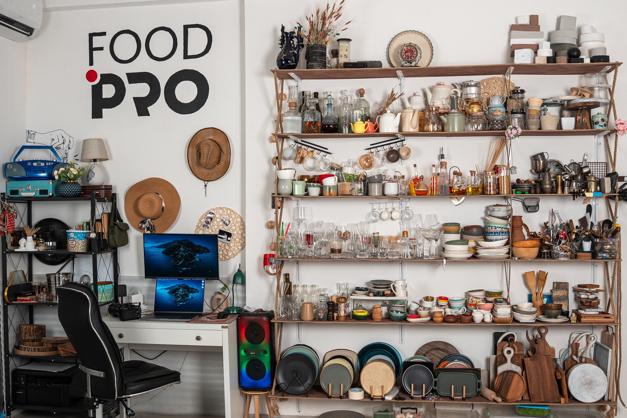 FoodPro studio filled with props, dishware, and a professional workspace for photography.