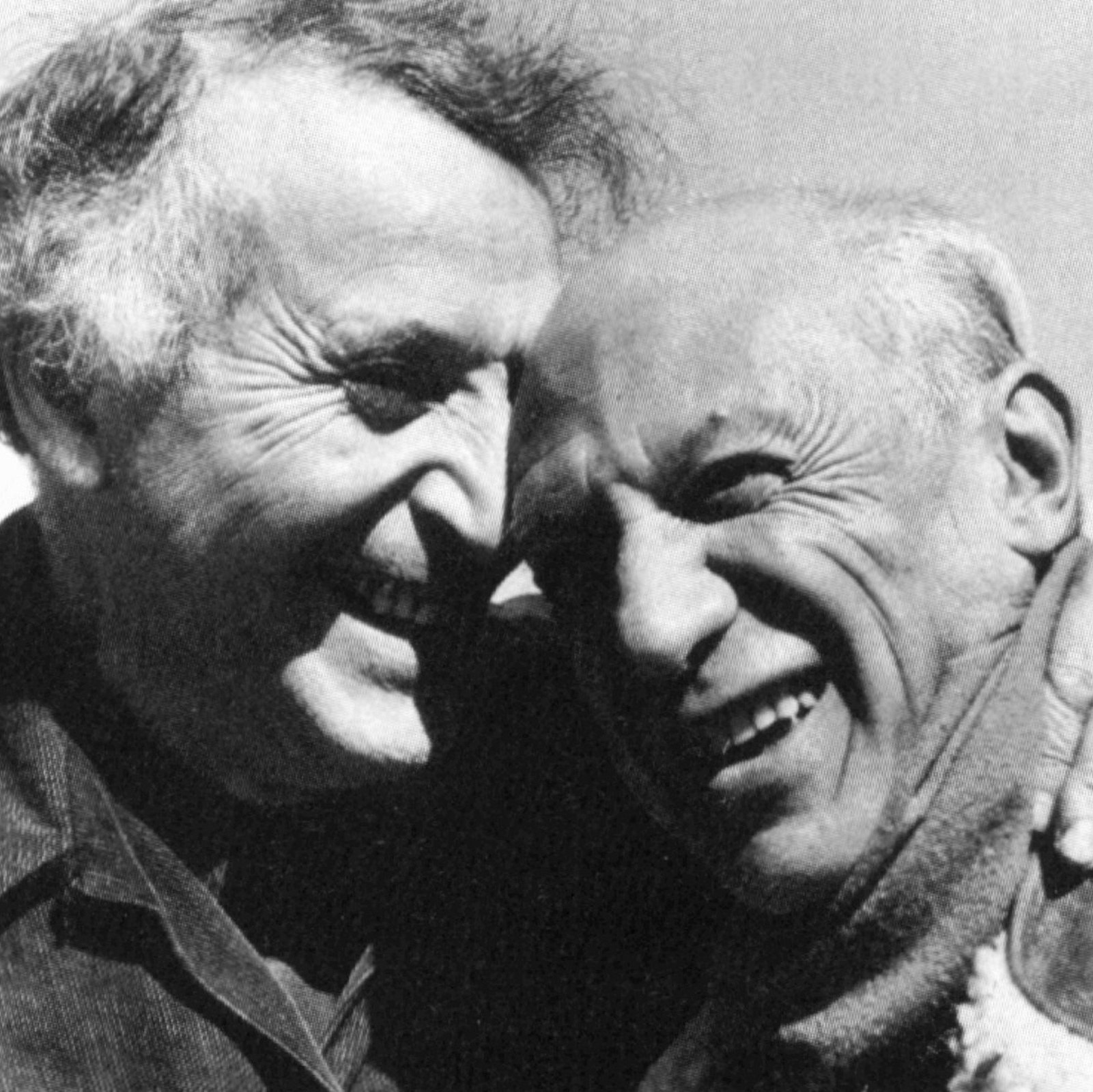 This photograph captures a moment of camaraderie between two giants of modern art, Pablo Picasso (right) and Marc Chagall (left), taken in 1955 by photographer Philippe Halsman.