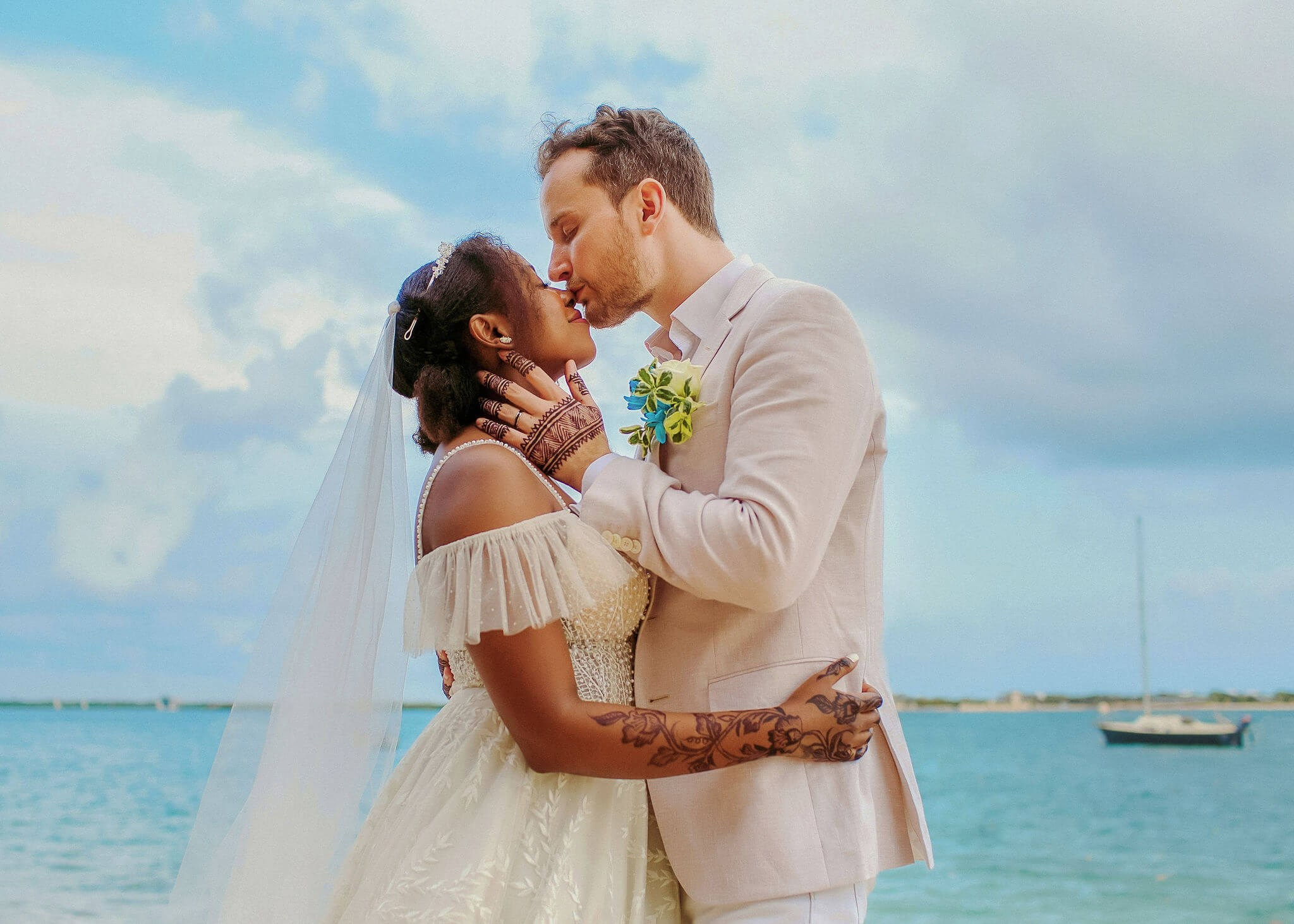 Romantic seaside wedding kiss at Shela Beach, Lamu. Maiafreia photography documents intimate, windswept moments along Kenya’s stunning island shores.