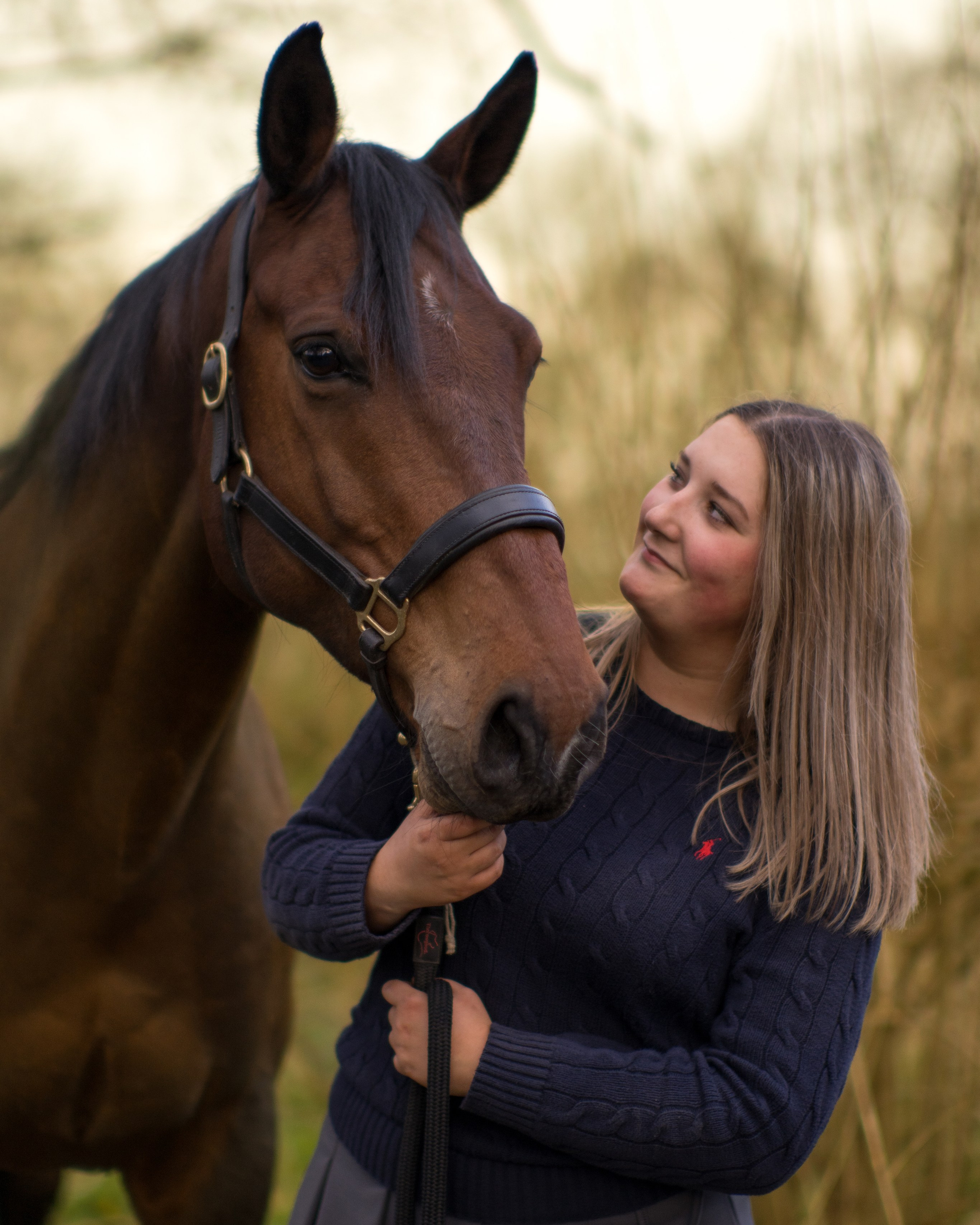 Horse and owner looking at each other with affection in rural Leicestershire