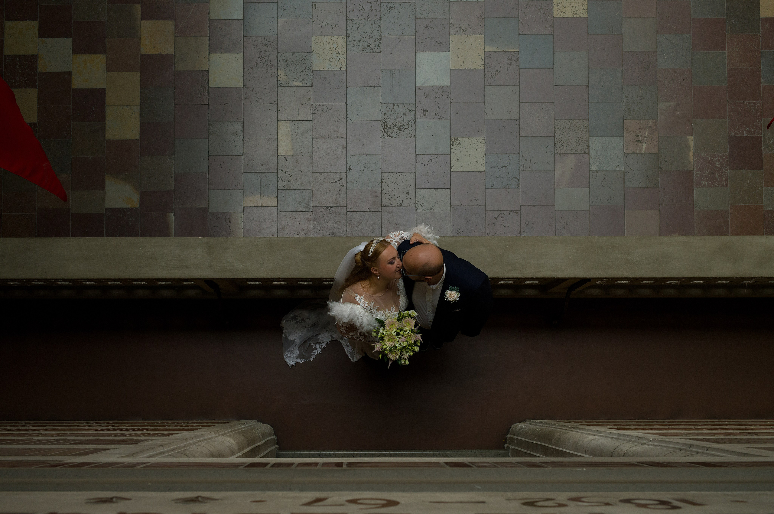 Bride and groom sharing a quiet moment inside Copenhagen City Hall