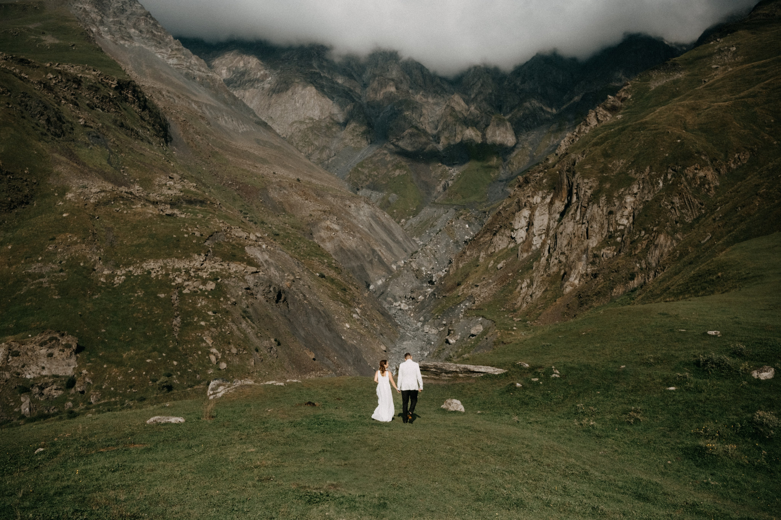 Couple portrait session in Kazbegi with open alpine landscape