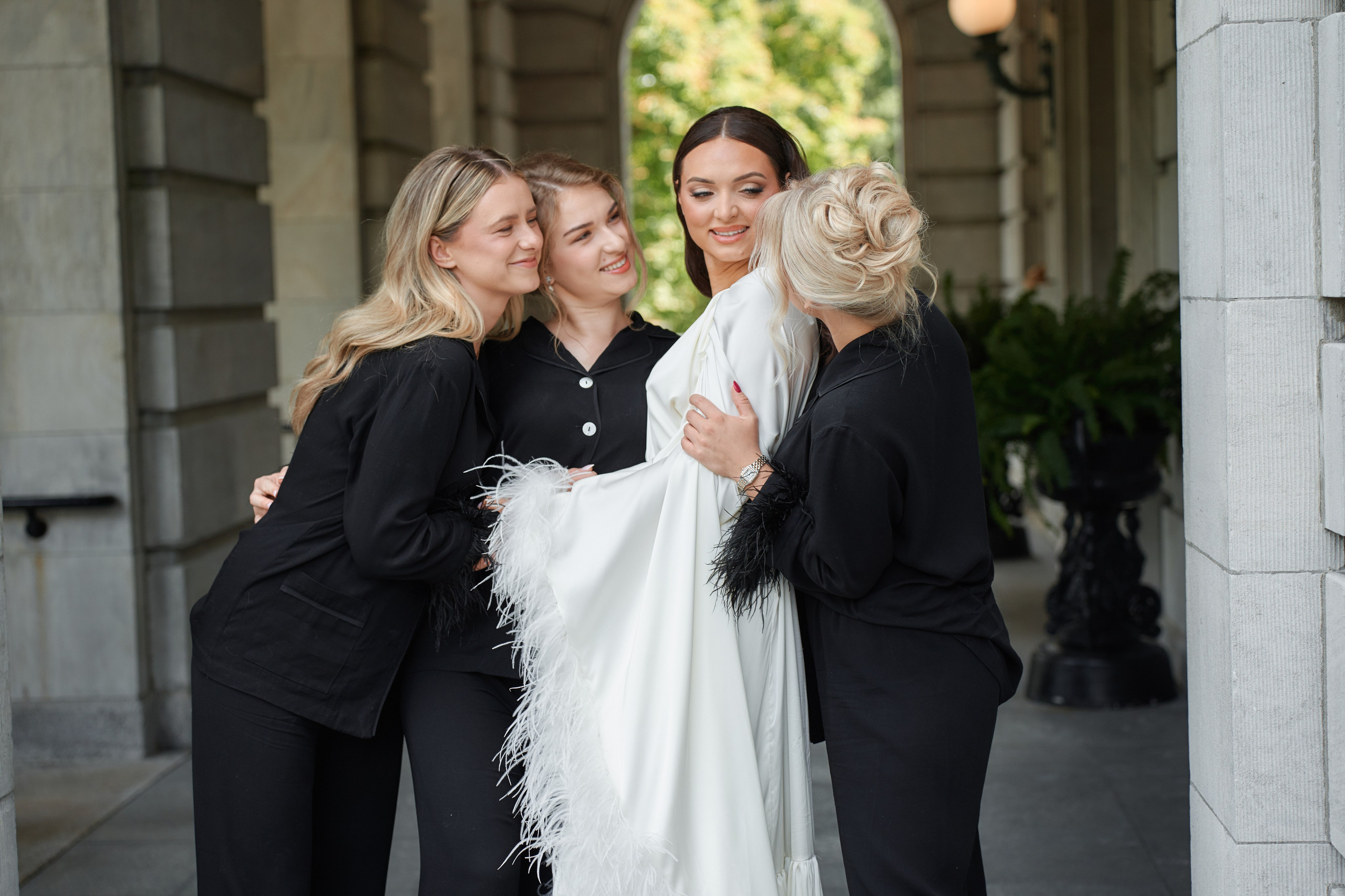 Wedding photography of bride smiling with friends and bridesmaids at luxury venue in New Jersey