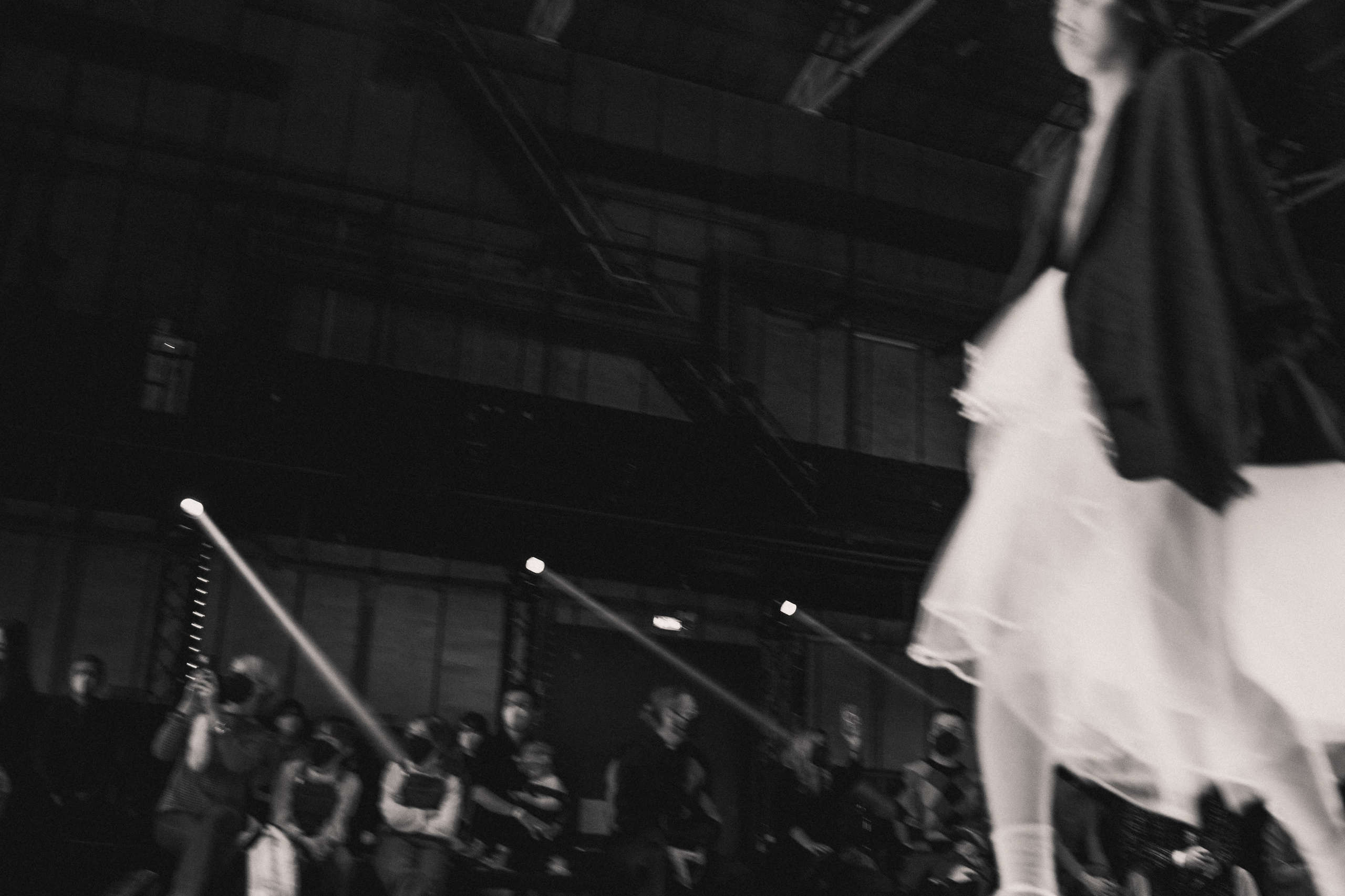 Backstage at Rome Fashion Week: models and designers in final moments before the runway.