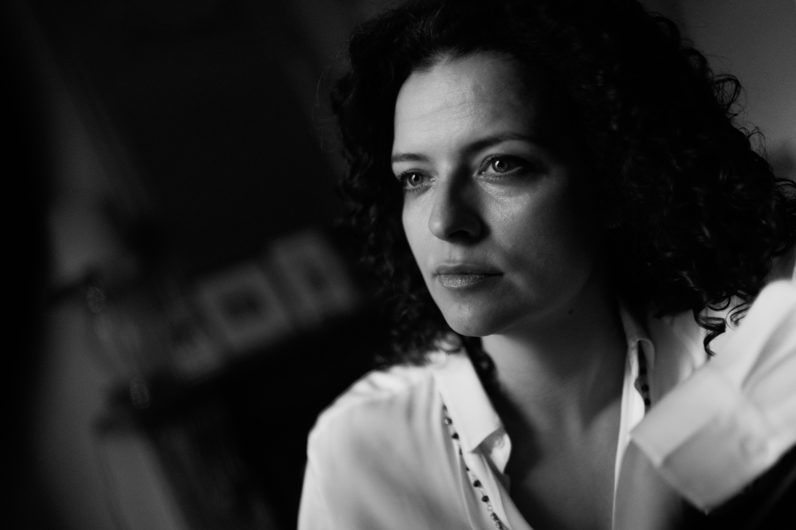 Quiet black and white portrait with soft window light, photographed during an Artistic Discovery Session in Solihull.