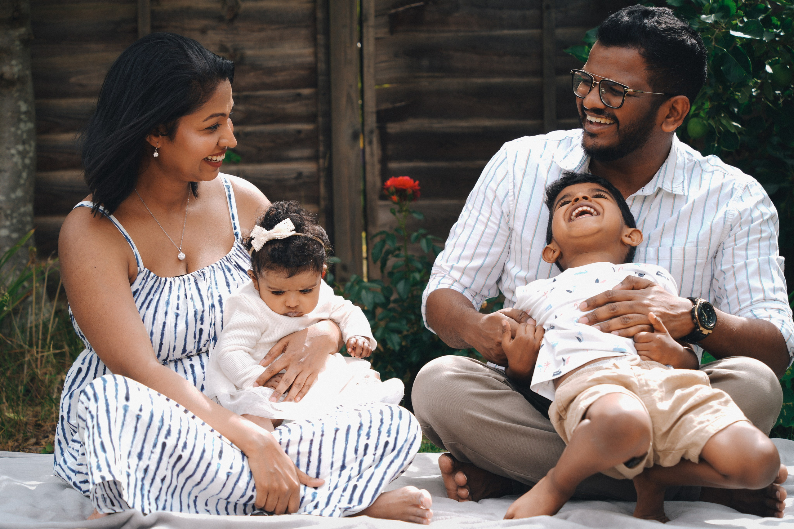 Family sitting together with newborn baby during a natural lifestyle photo session, Solihull