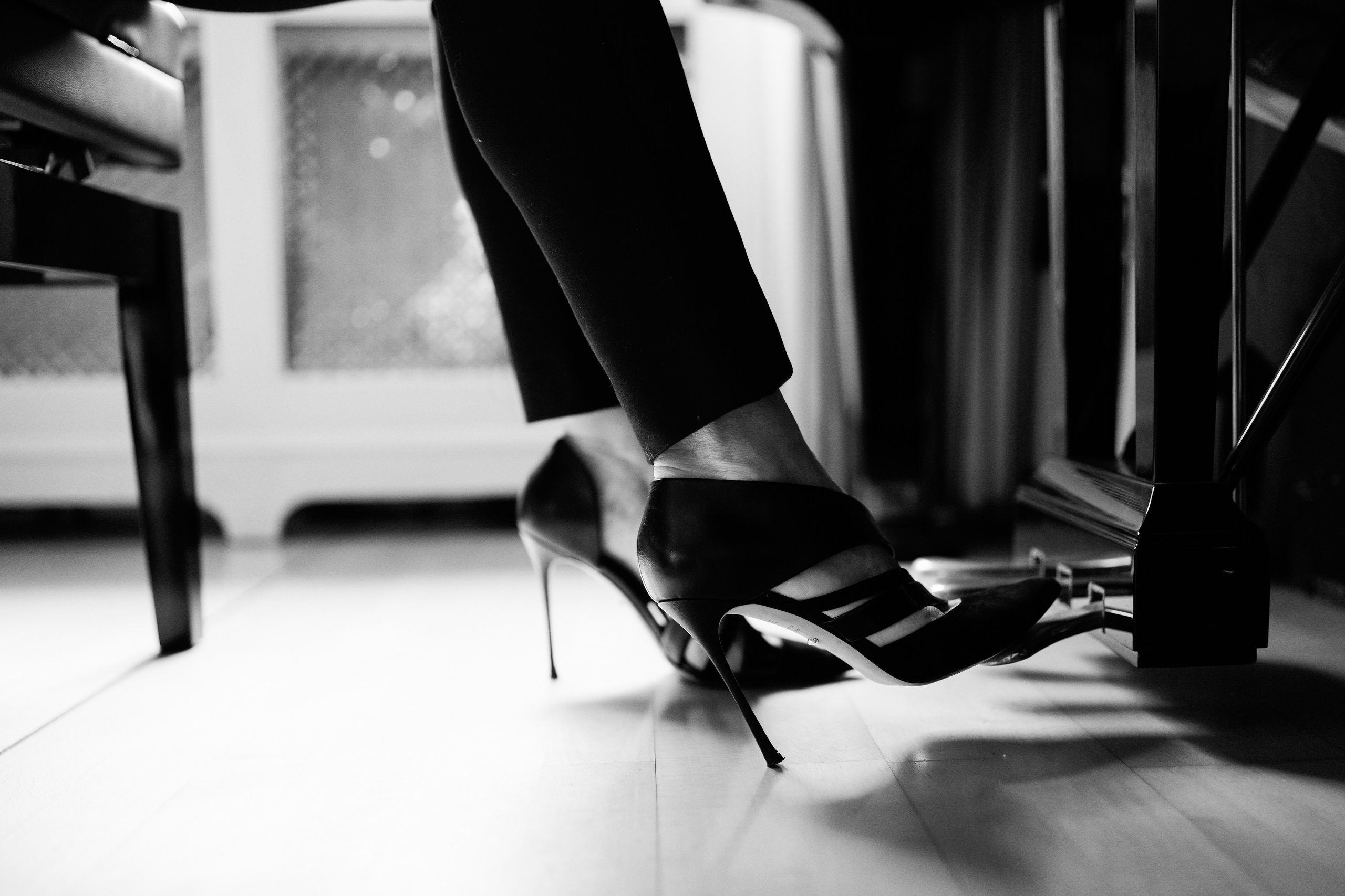 Black and white detail of a pianist’s feet and pedals, captured as part of an Artistic Discovery Session in Solihull.