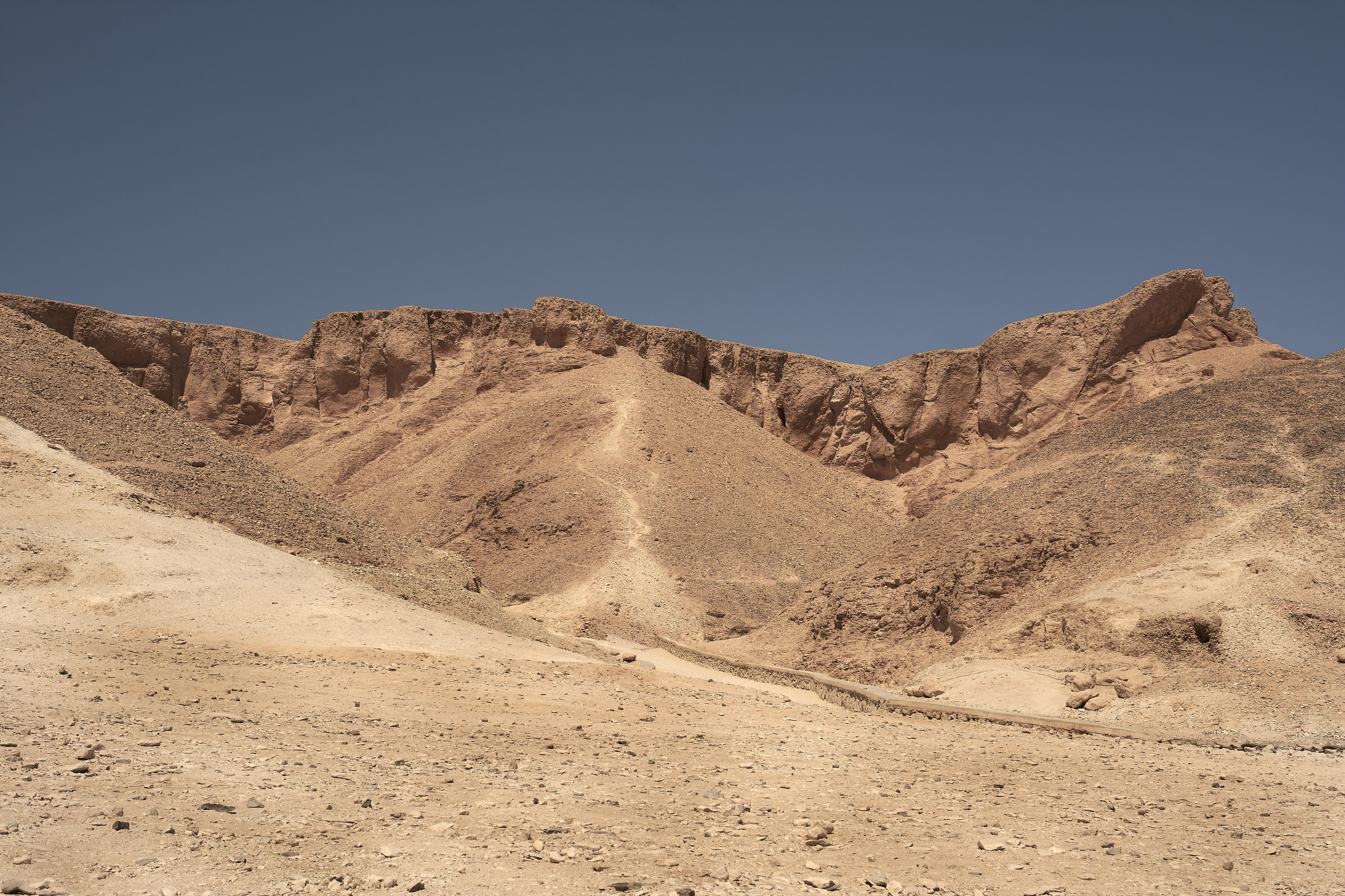Barren Egyptian desert valley under clear sky