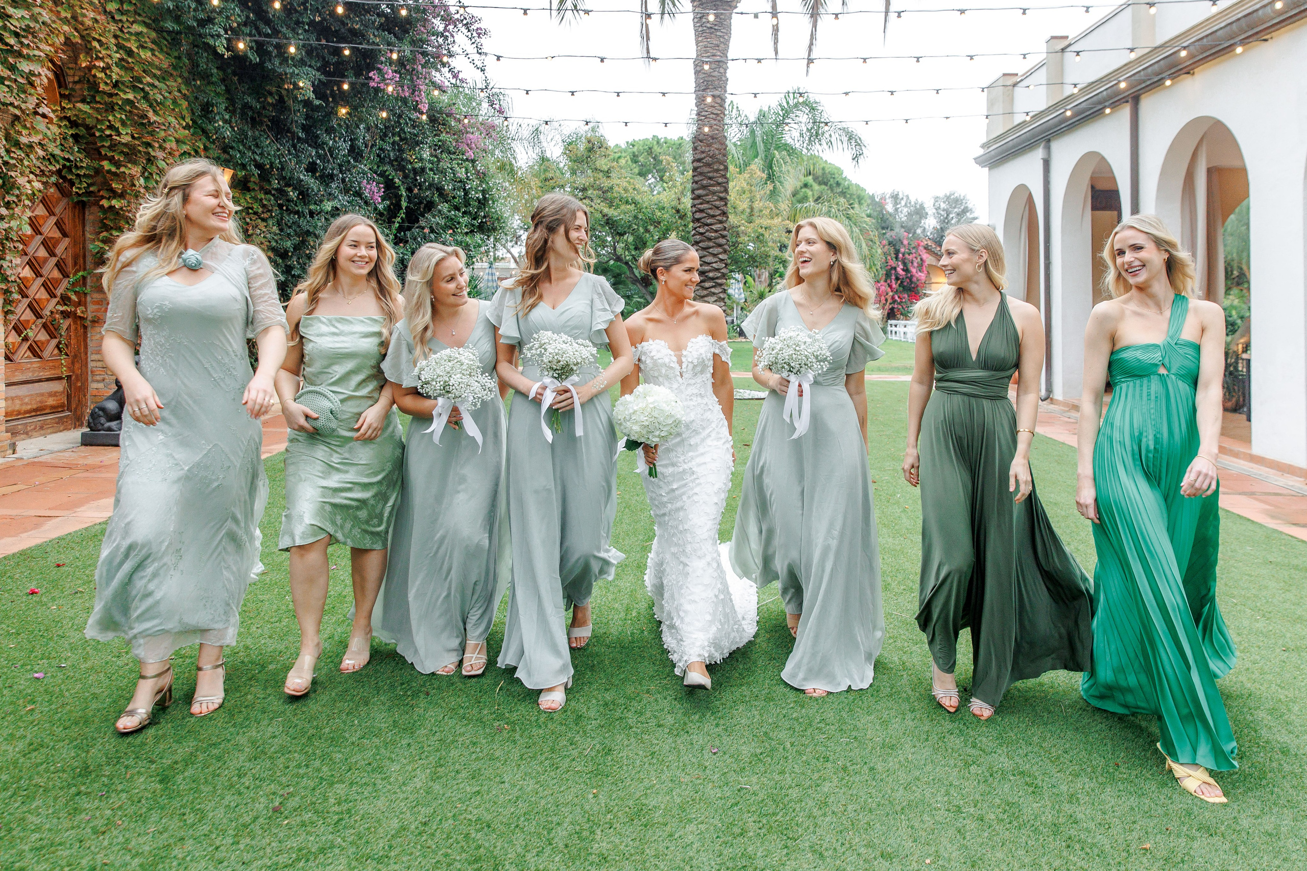 Candid shot of the bride laughing with bridesmaids during the wedding in Barcelona