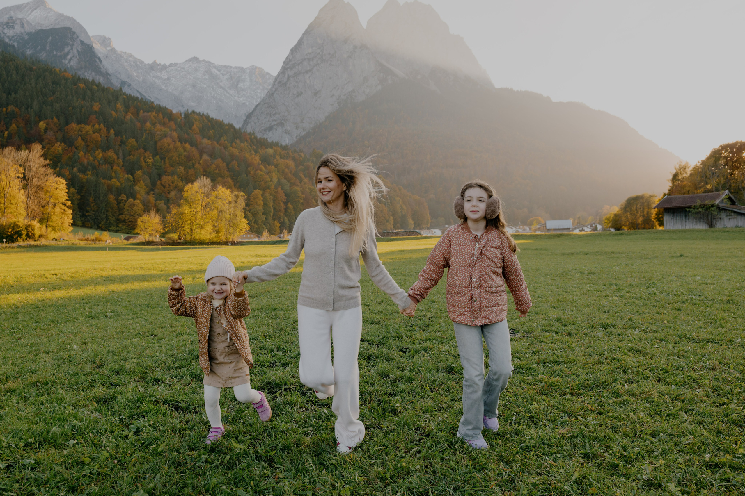 Candid moment of couple hugging in snowy Dolomites winter landscape