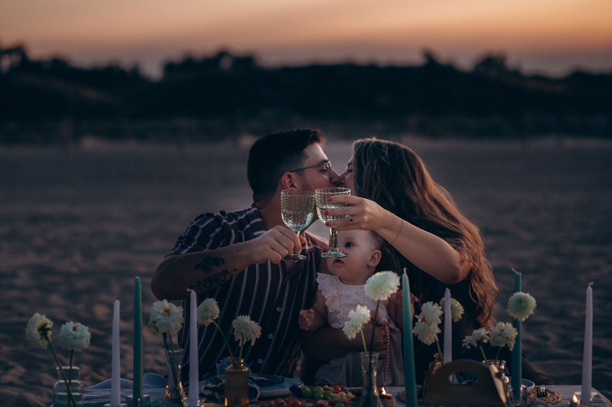 Couple sharing a romantic moment at sunset during a Costa Blanca photoshoot in Alicante, Spain
