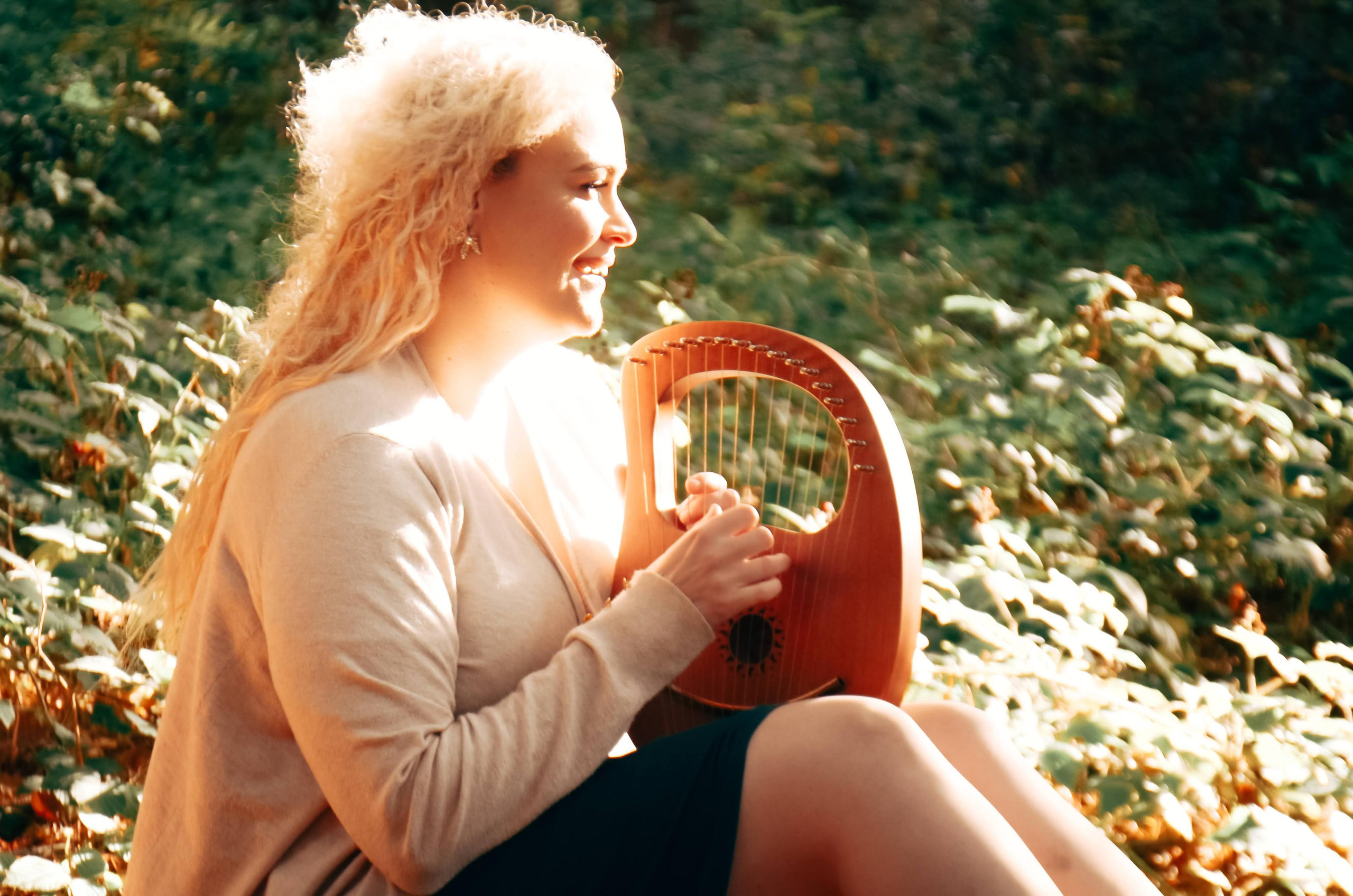 I girl playing the harp in Magic Forest. Feedback on Iyengar yoga lessons.
