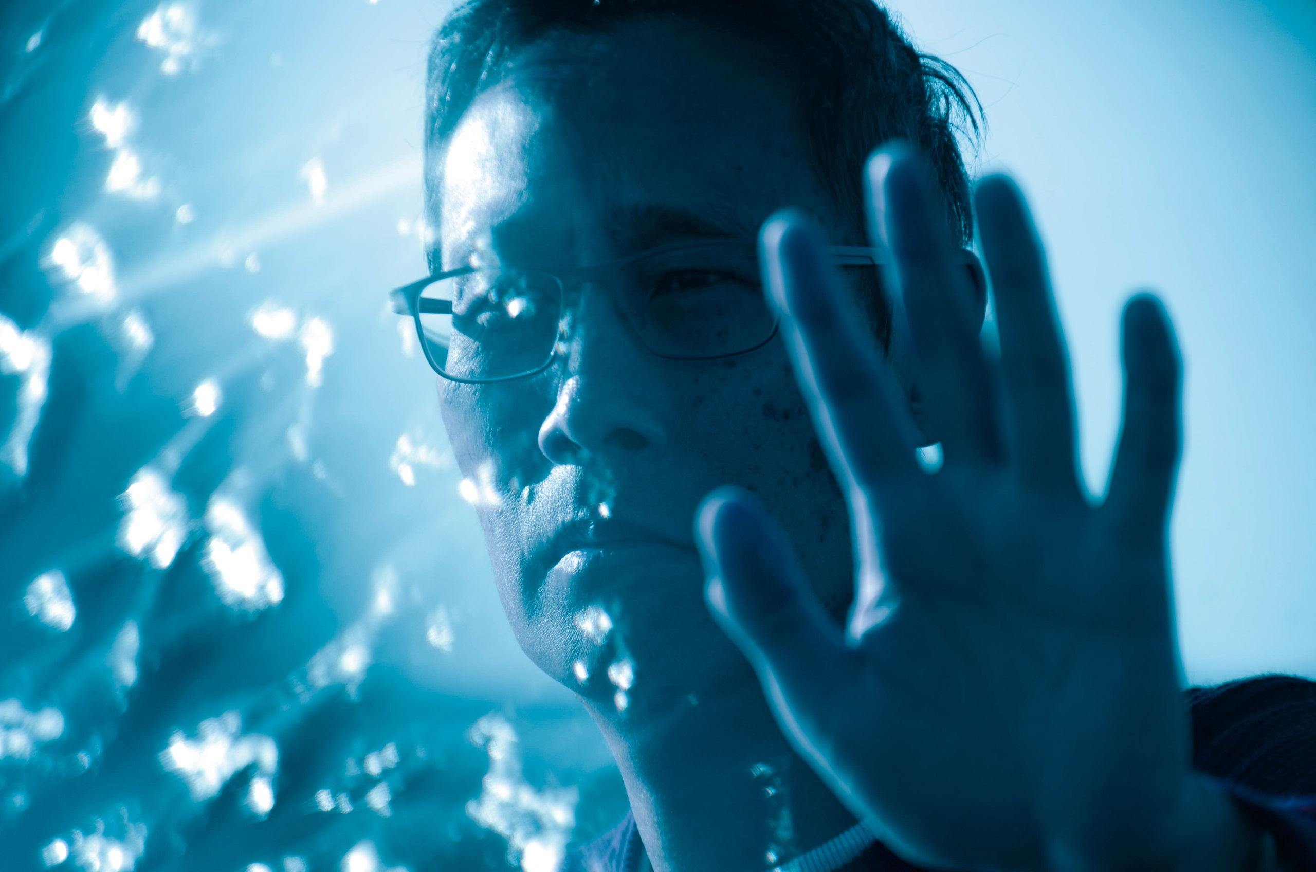 Expressive artistic portrait using light and reflection by fine art photographer in Solihull