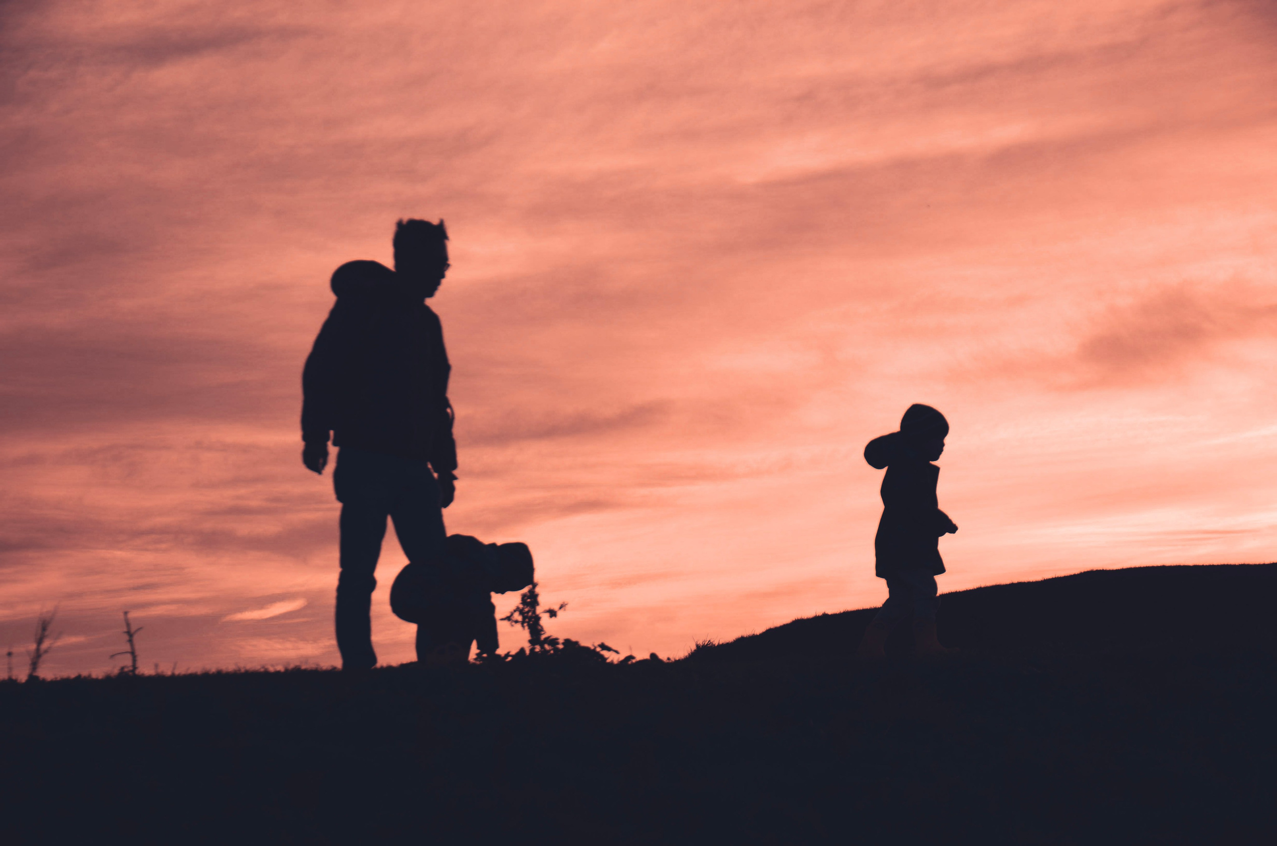 Emotional family silhouette portrait at sunset photographed in Birmingham and Solihull area