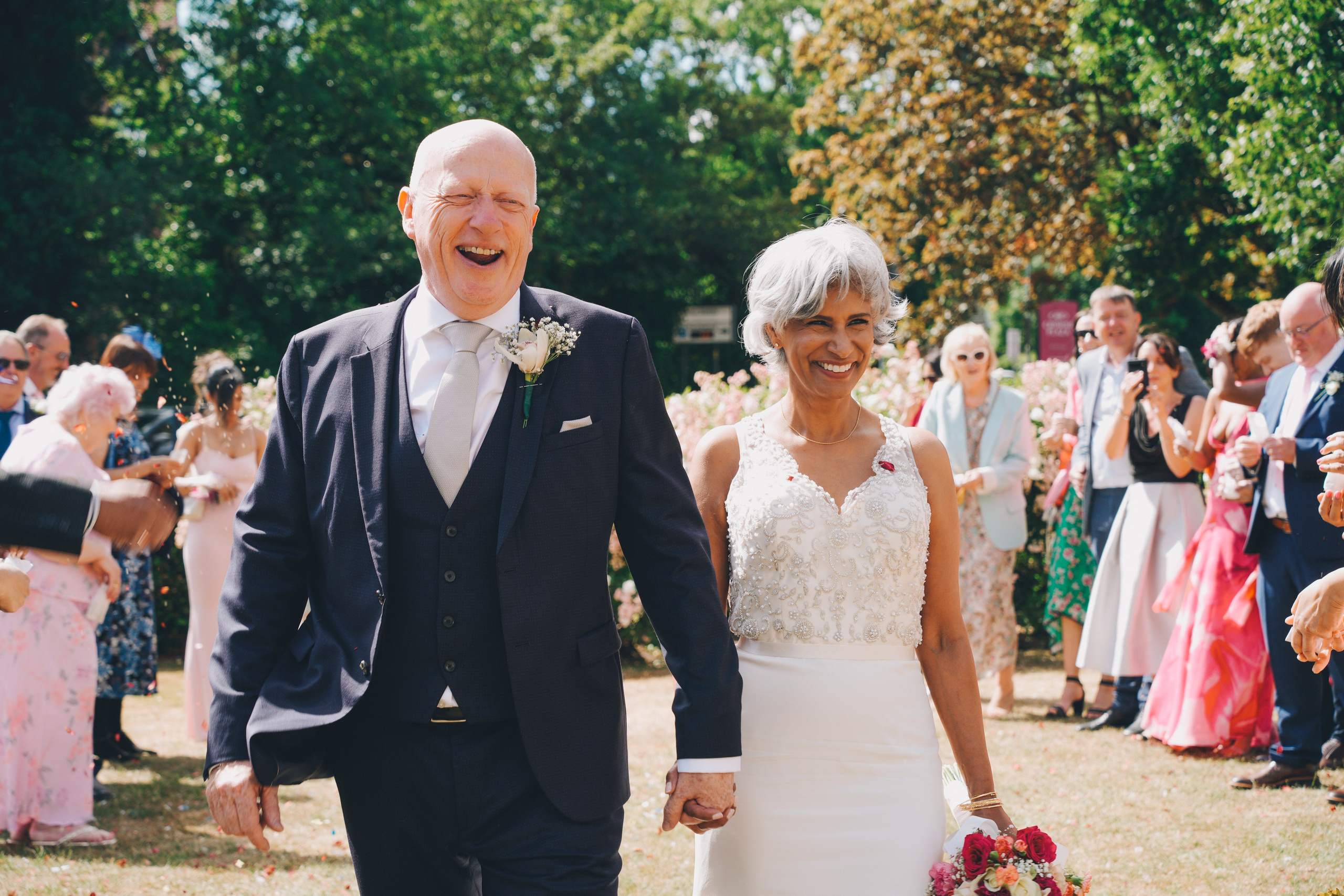 Confetti fills the air as the couple steps out of Solihull register office, surrounded by laughter, love and the start of something new.