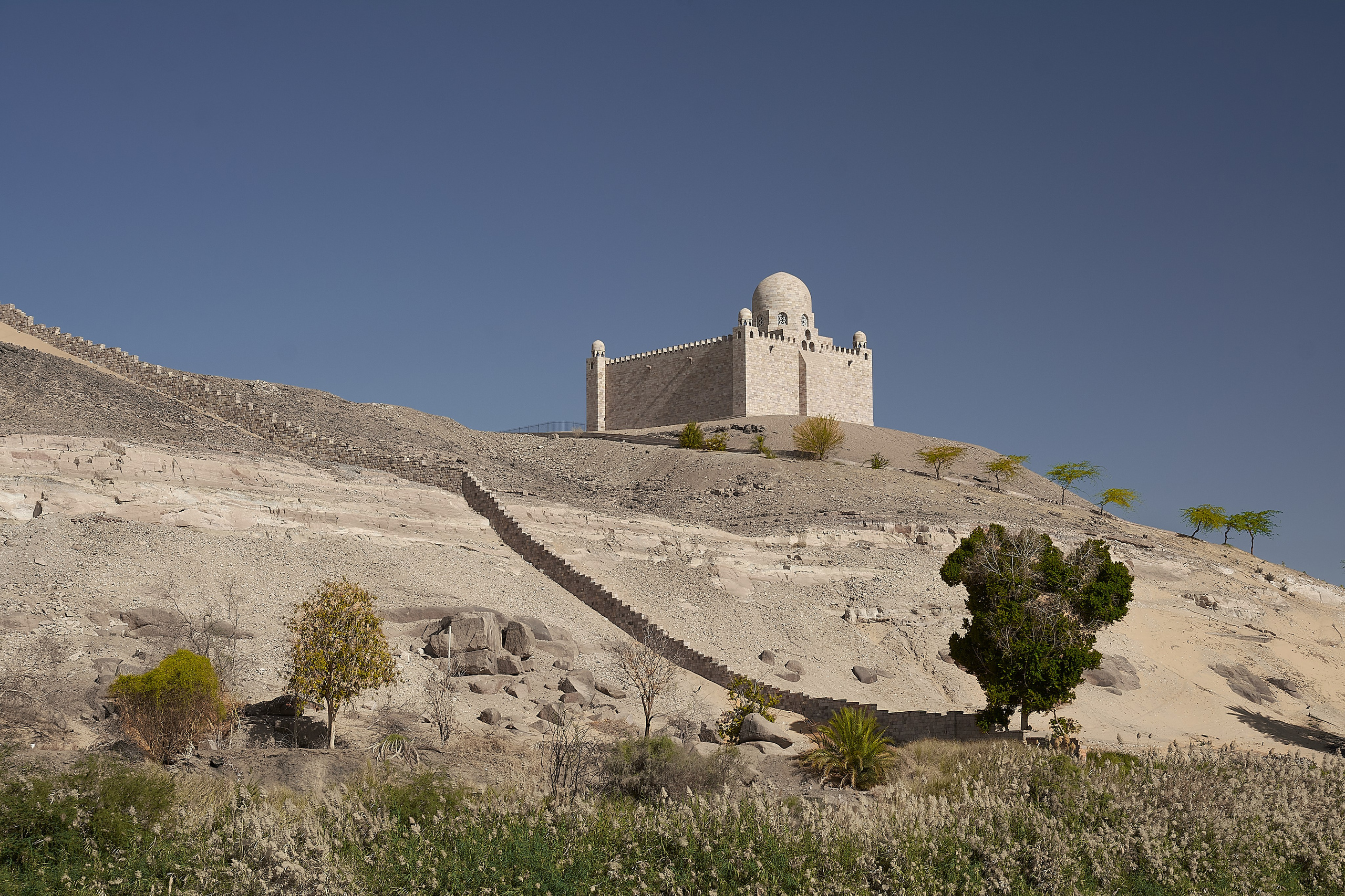 Ancient mausoleum crowning desert rocky hill