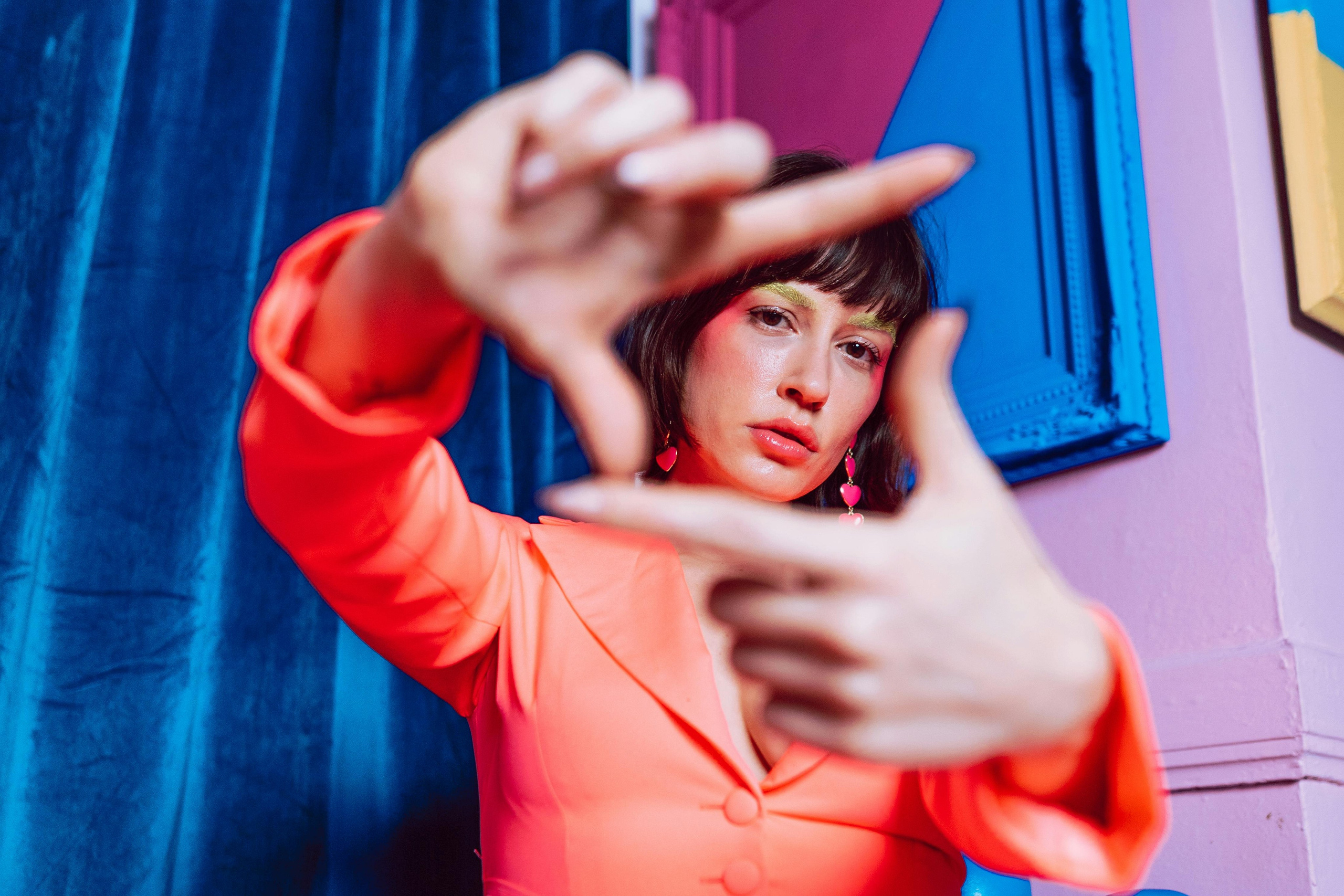 Vibrant Portrait of a Woman Framing Her Vision for Creative Branding