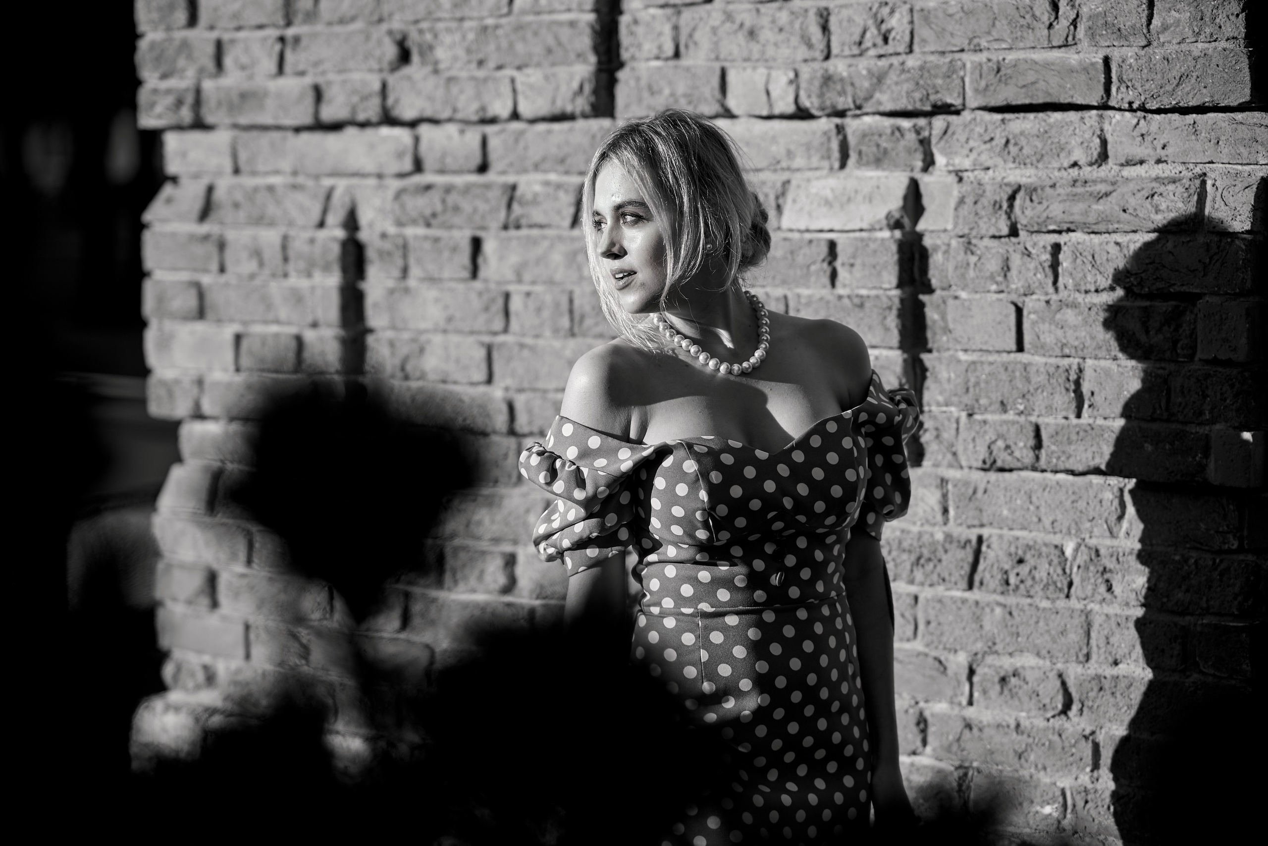 Black and white outdoor photo of a woman in a summer dress in NJ