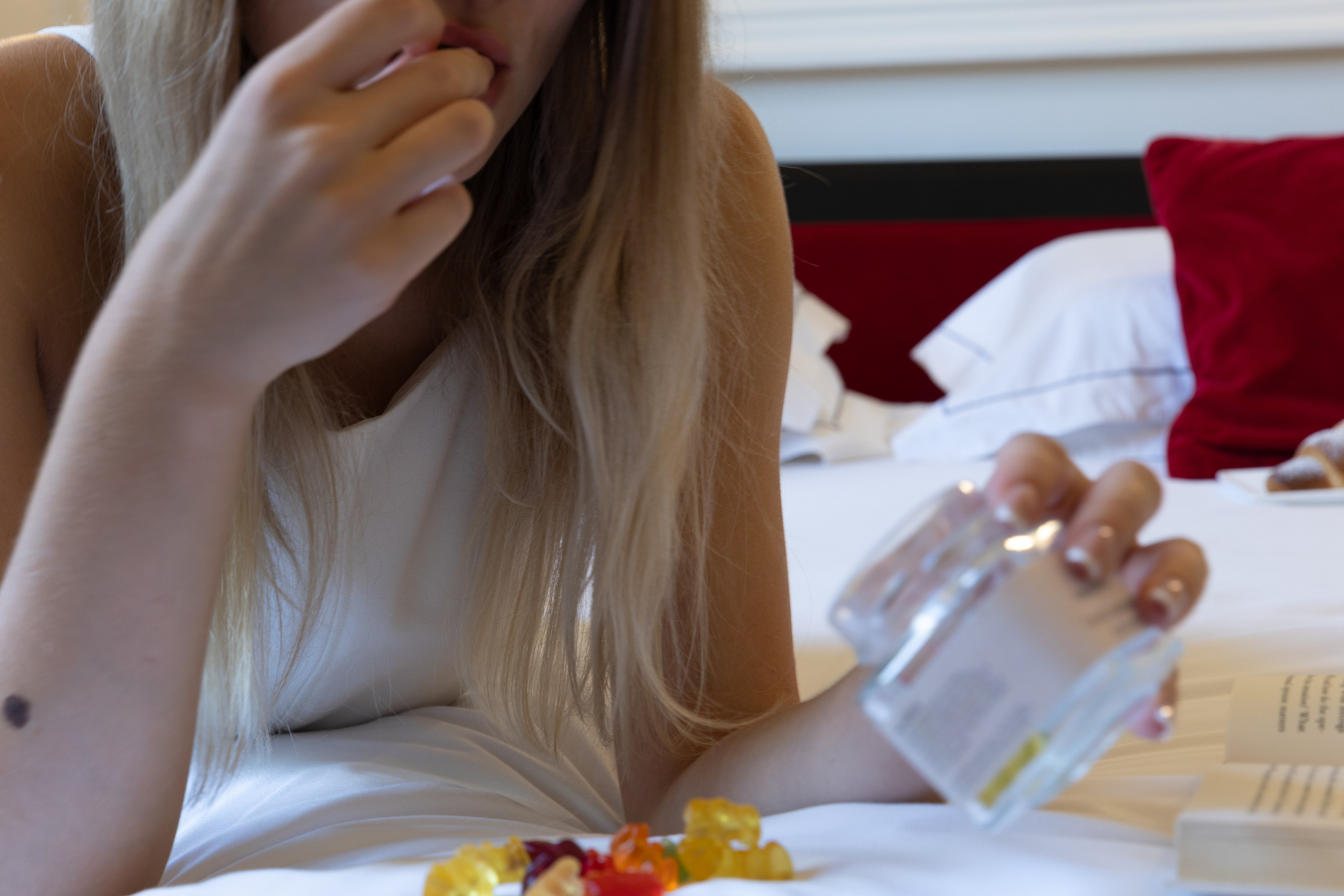 Authentic lifestyle portrait of a model in a moody, elegant hotel room, illustrating the shift from influencer marketing to experience-based branding.