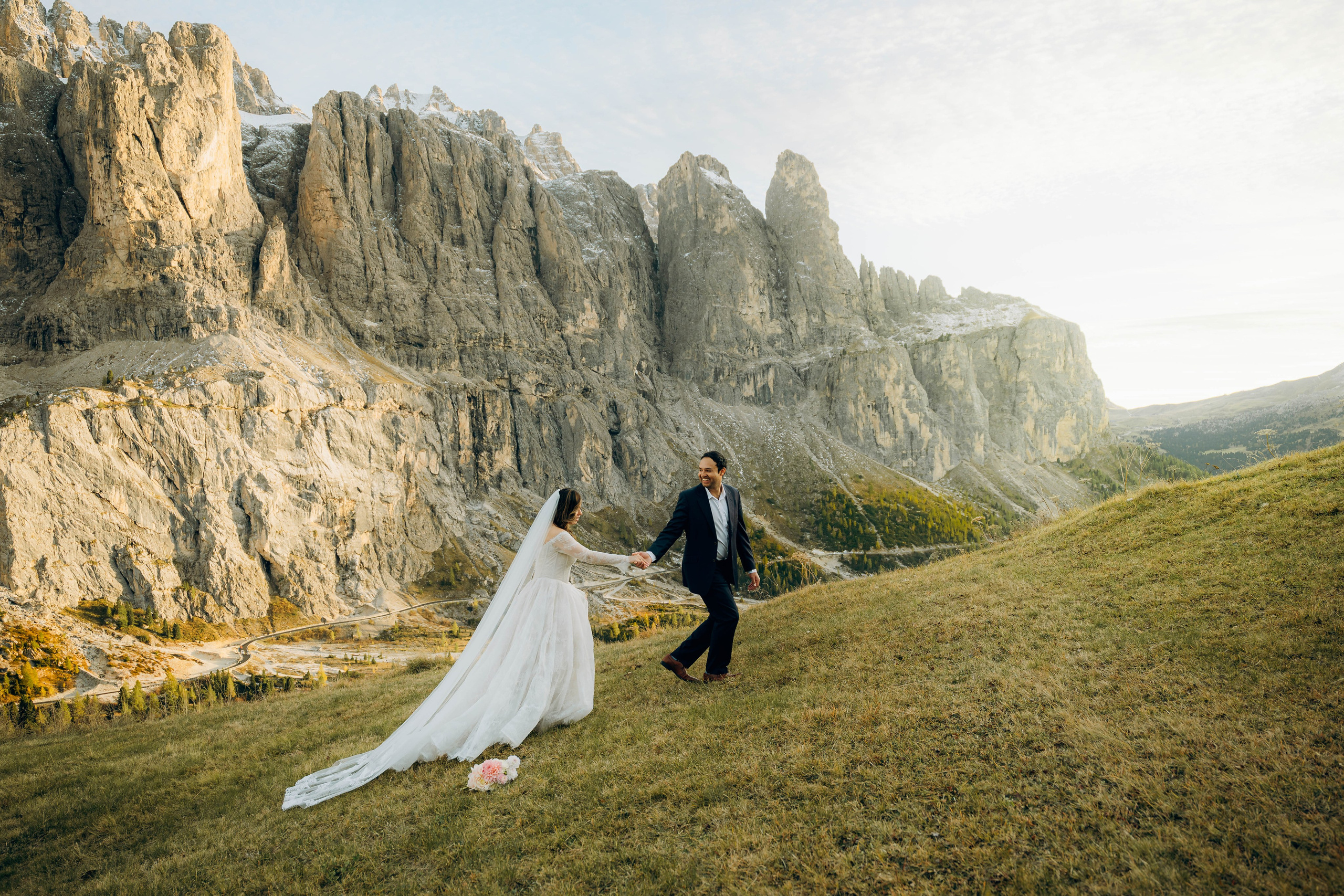 Romantic elopement in the Dolomites with couple exchanging vows surrounded by dramatic mountain peaks