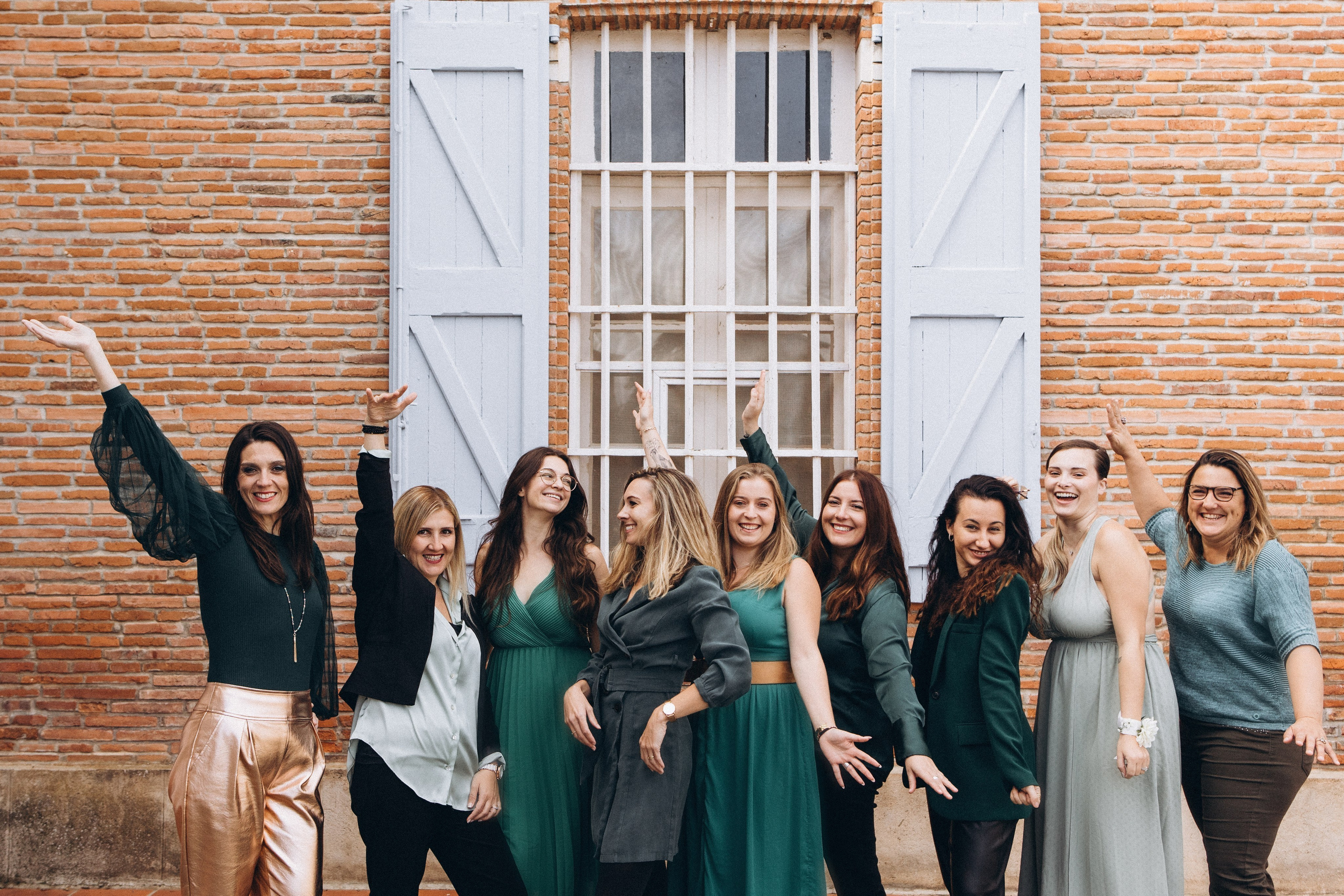 Team of wedding vendors celebrating together in Southwest France