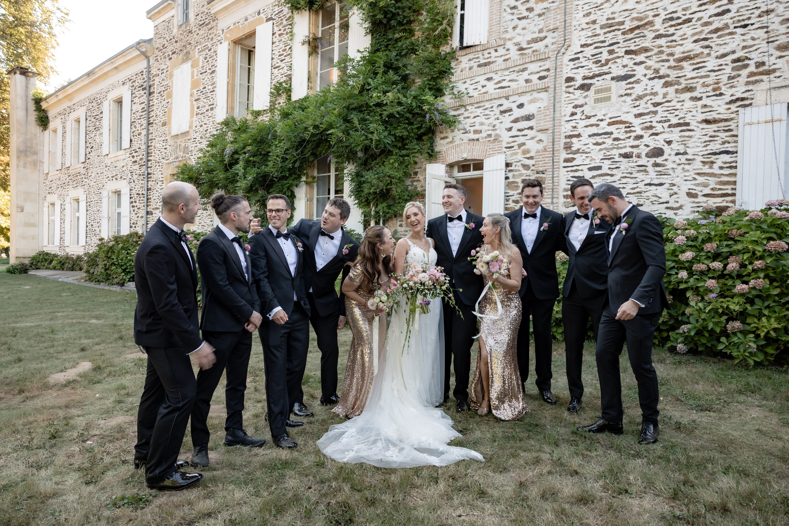 Bride and groom embracing in soft afternoon light at Château Sentout during their destination wedding in France.