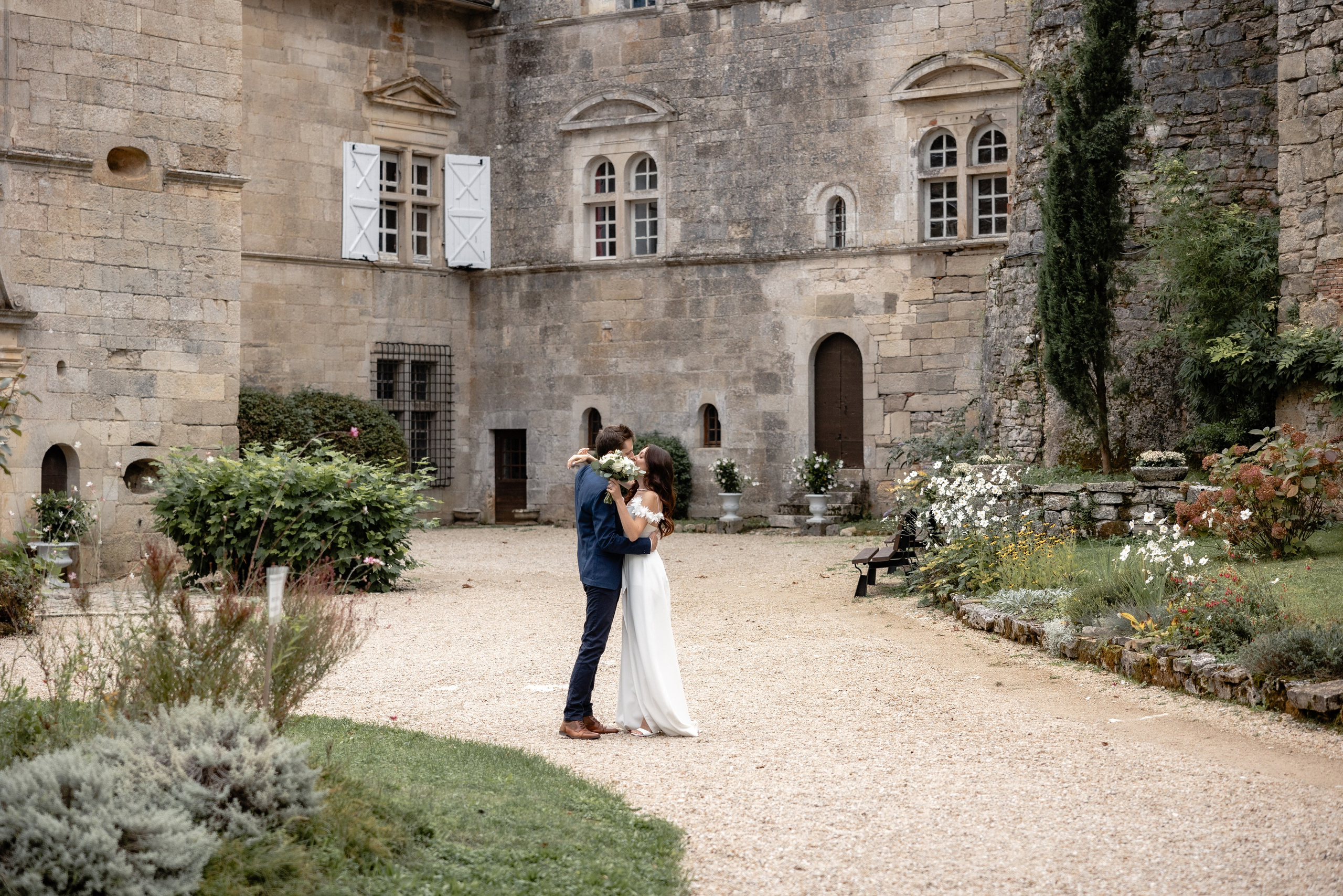 Intimate elopement ceremony in the French countryside with a couple exchanging vows