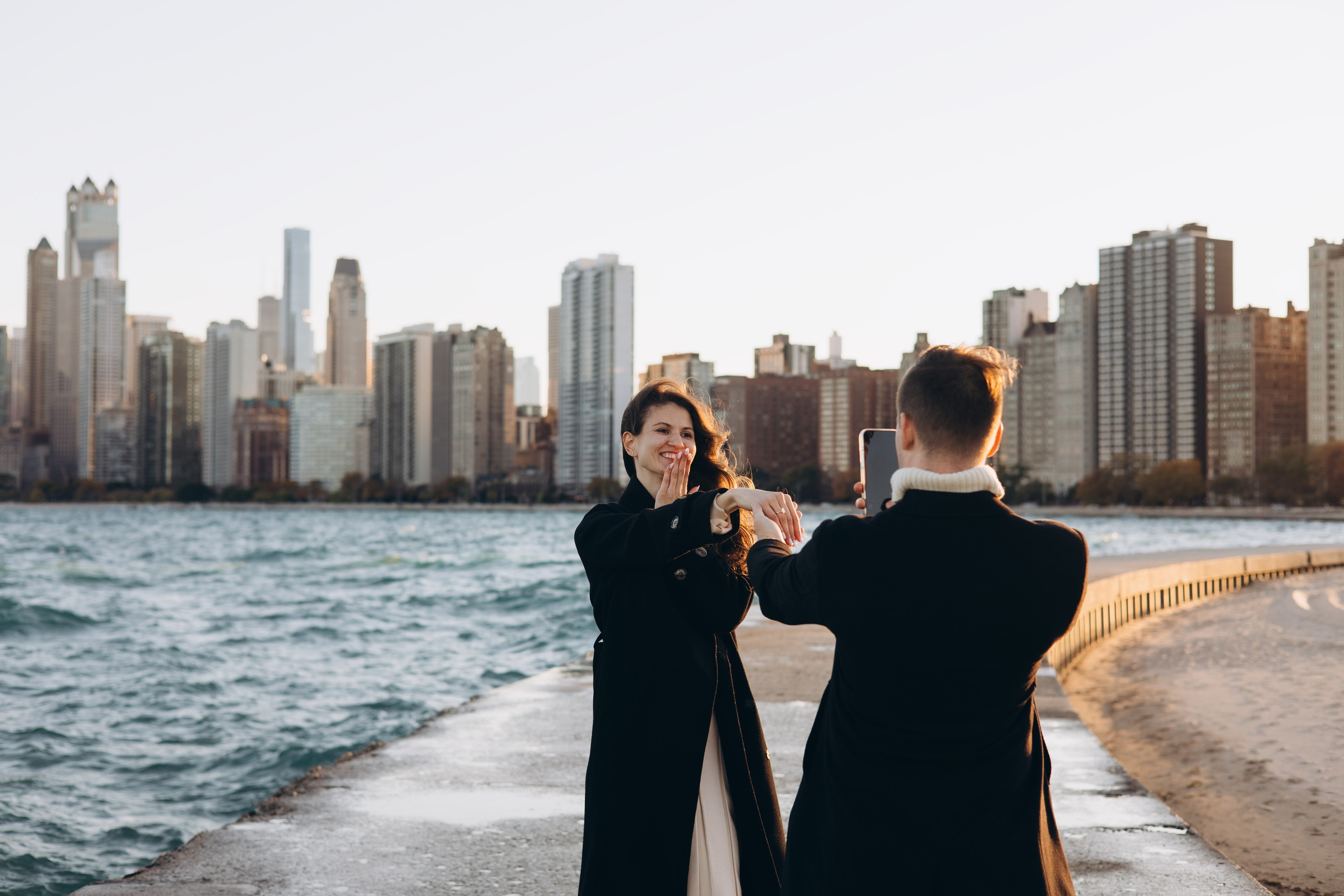 Soft sunset light on a couple during a proposal photoshoot in Chicago.
